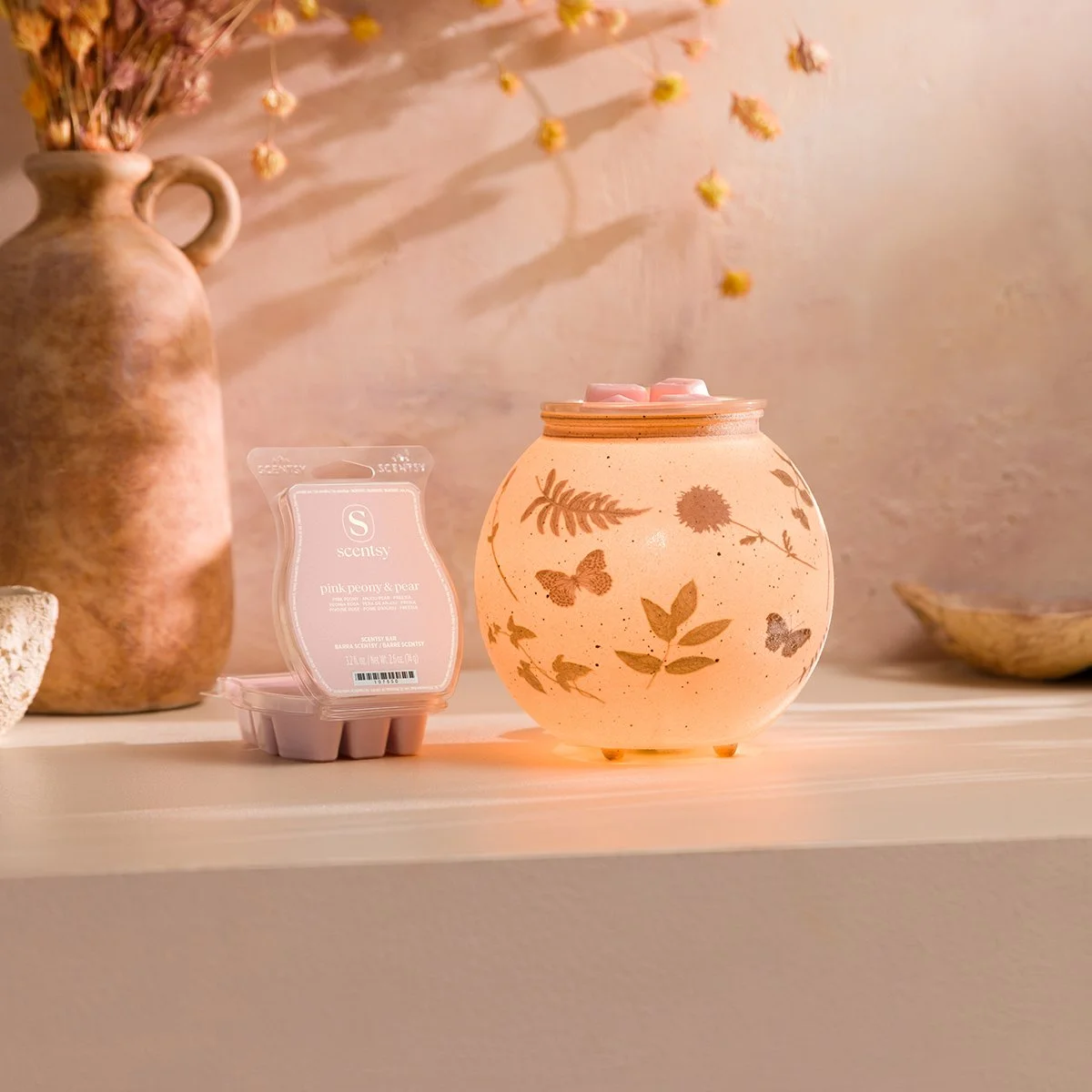 Veiled Meadow Scentsy Warmer glowing softly alongside the Pink Peony & Pear Scentsy Wax Bar in a styled setting