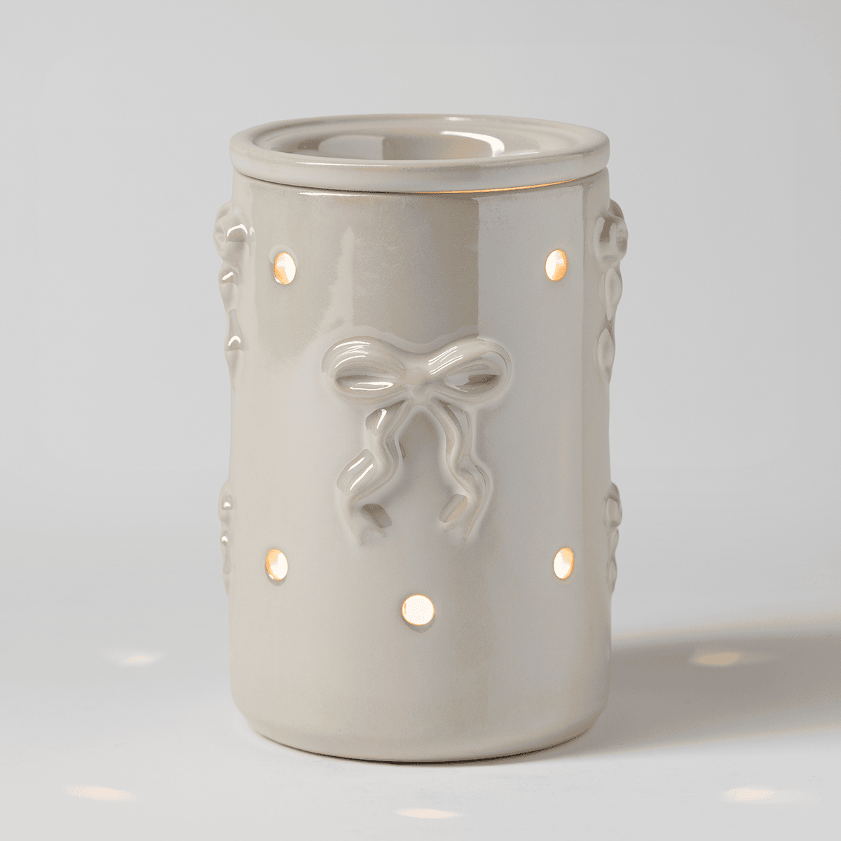 Dreamer's Bow Scentsy Warmer glowing