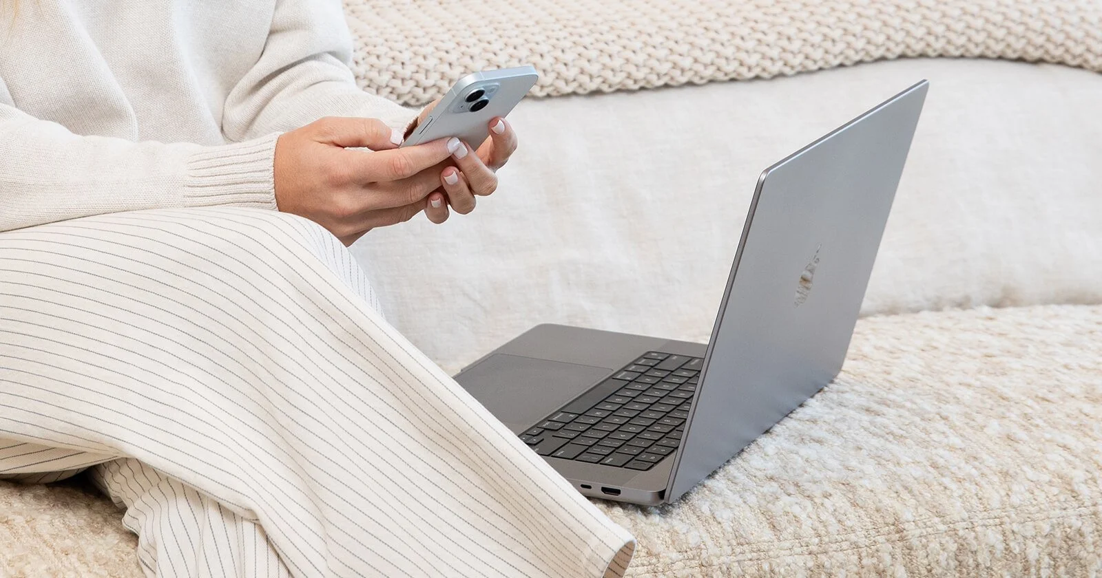 scentsy smart start kit in a styled image with a lady working on her phone and computer