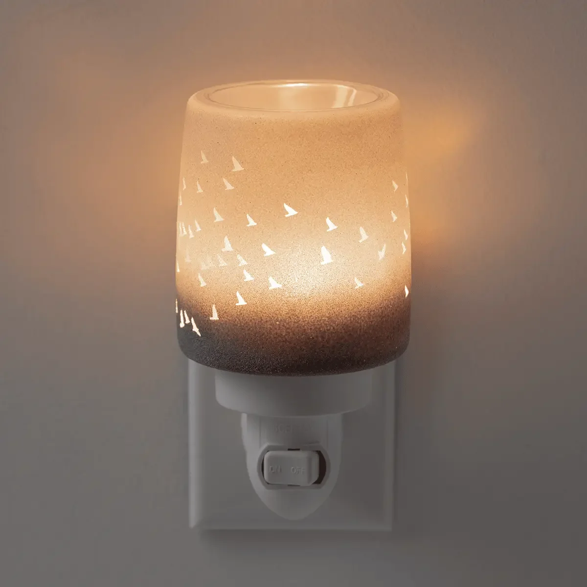 Scentsy Waves and Wings mini warmer illuminated with bird silhouettes