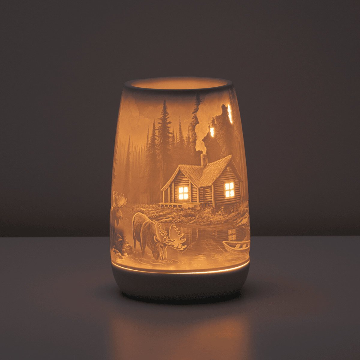Mountain Retreat Scentsy Warmer glowing in a dark room with illuminated mountain scenery