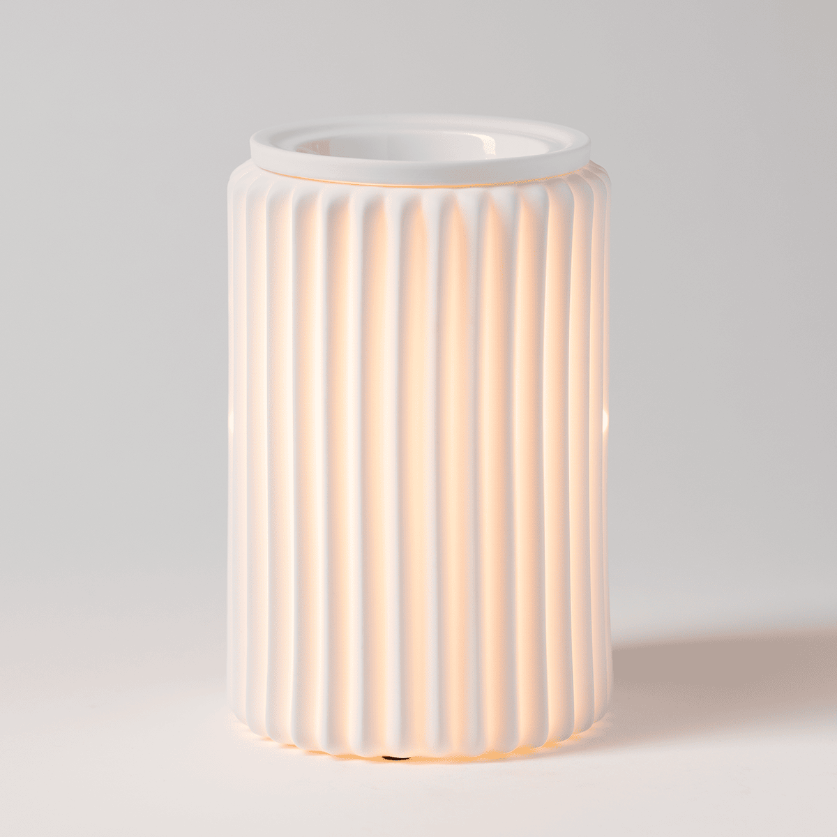 Fluted Glow Scentsy warmer Vertical fluted porcelain Scentsy warmer glowing softly