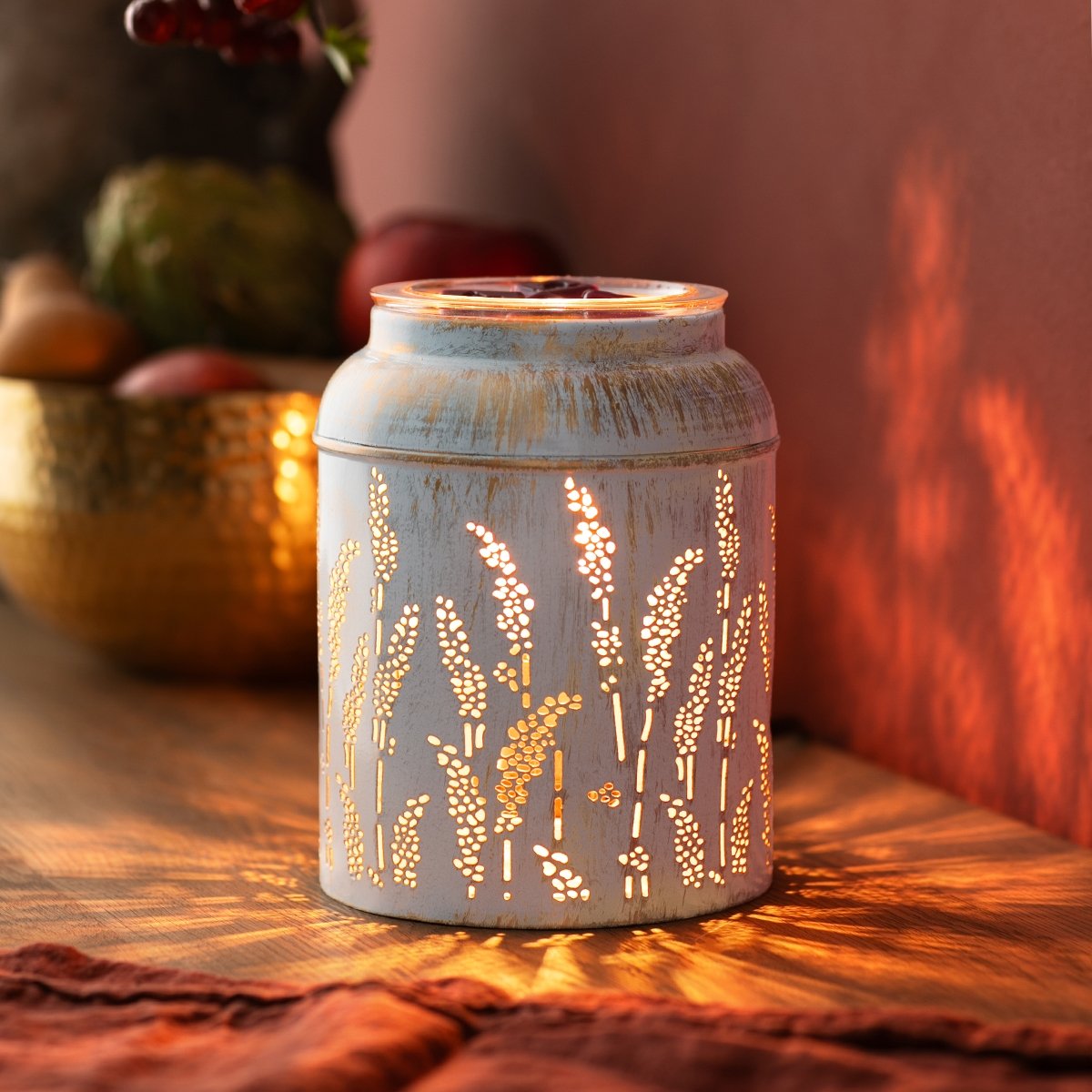 Close-up detail of stamped metal pattern on Golden Grain Scentsy Warmer