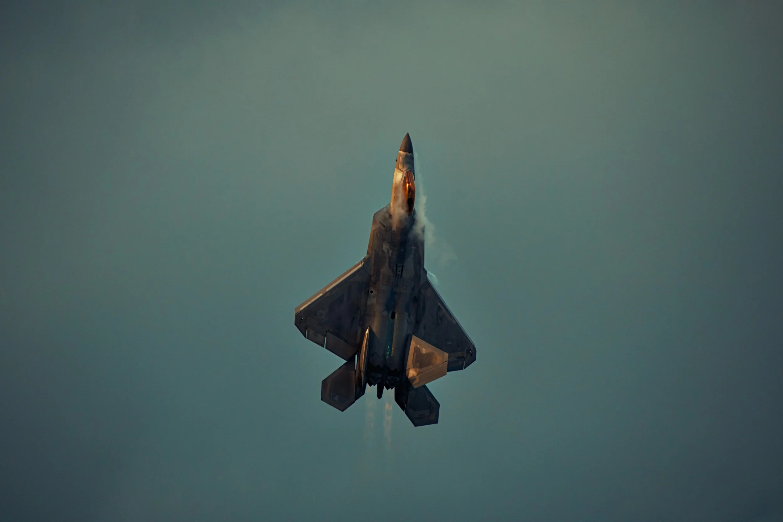 A golden hour shot of an F-22 Raptor at EAA AirVenture Oshkosh 2026.

I'm gonna say it, this is one of my all time favorites! I love the way the pressure cones and golden hour lights came out in this shot, but I will say that my 500mm lens felt a lit