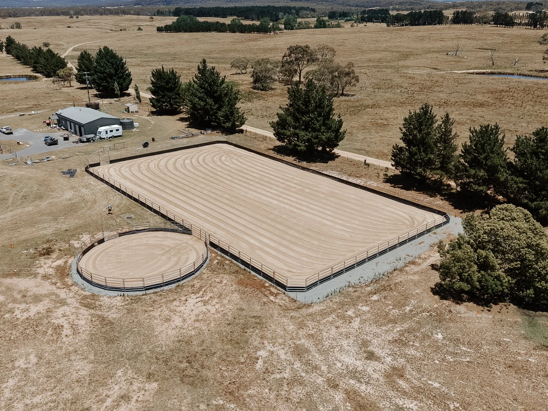 Aerial view of horse arenas and rural property earthworks