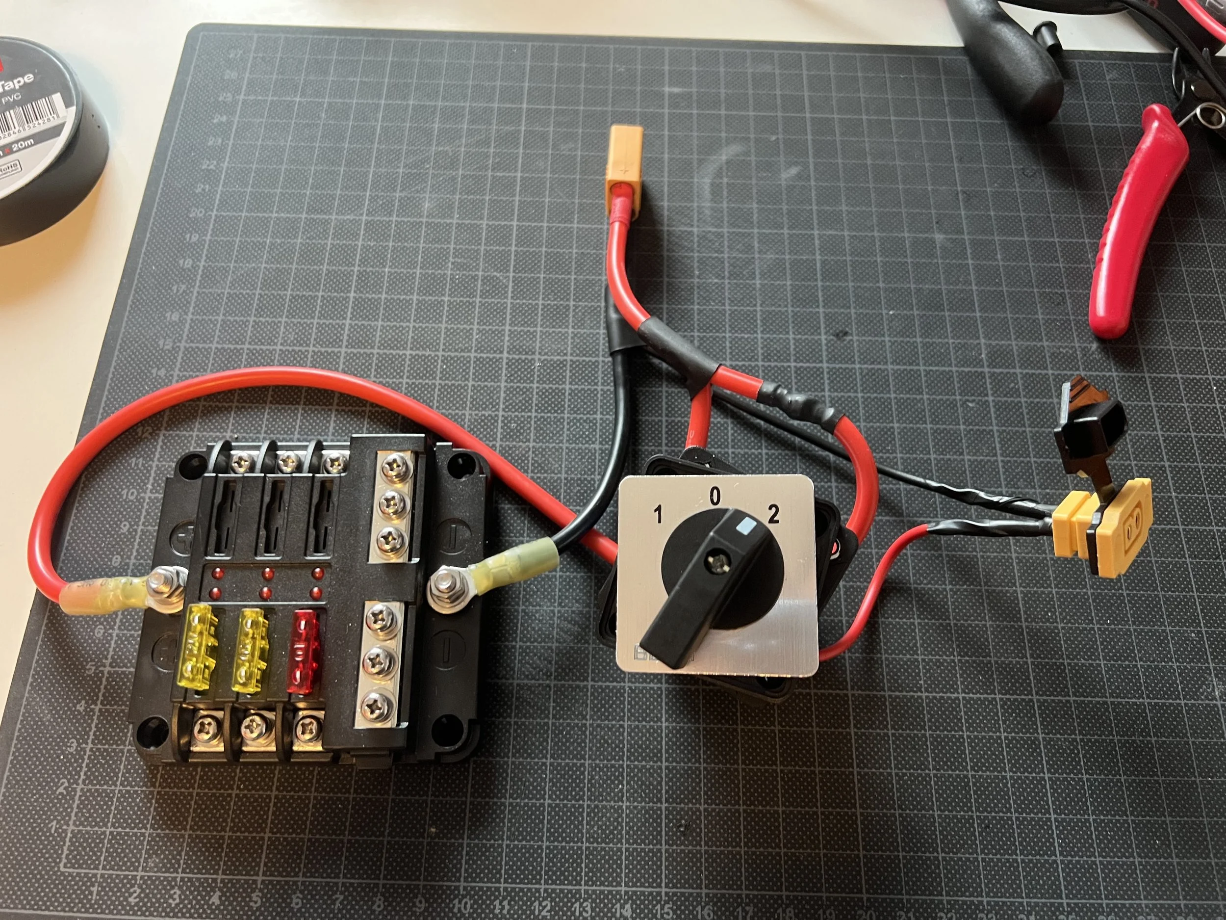 A rotating switch was integrated into the circuit to allow for on/off and charging/discharging states.