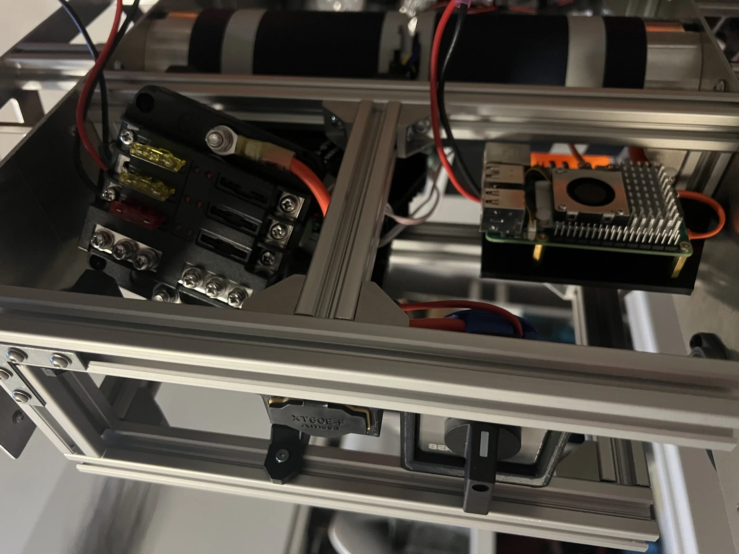 A frame was added to attach the components and mounts were created in SolidWorks and 3D printed.
