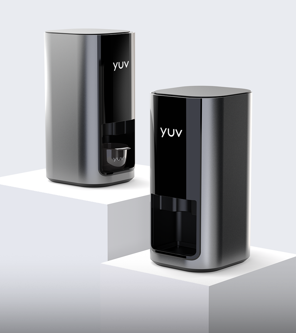 Two sleek, modern YUV branded coffee makers with black and silver finish, placed on white pedestals against a plain background.