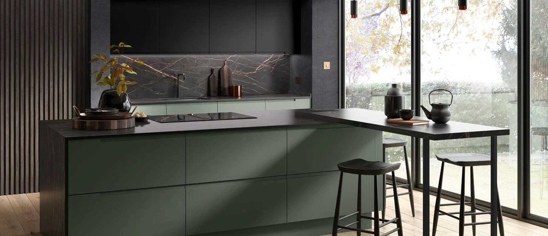 Remo kitchen with green cabinets and black countertop