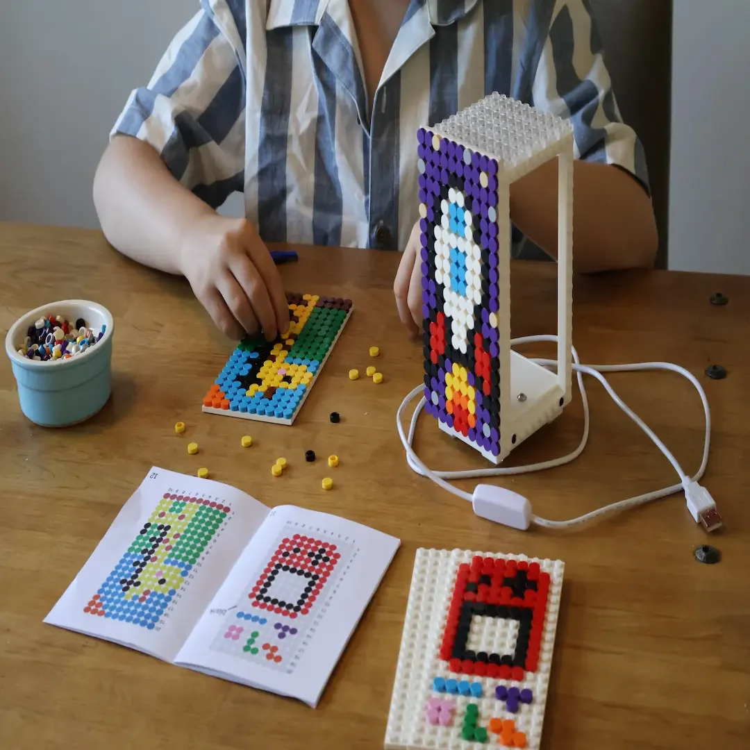 A Jaim lamp featuring a Portugal colors sports shirt design and a pixel art smiley face. Styled with a basketball and football background for a sports-themed bedroom.