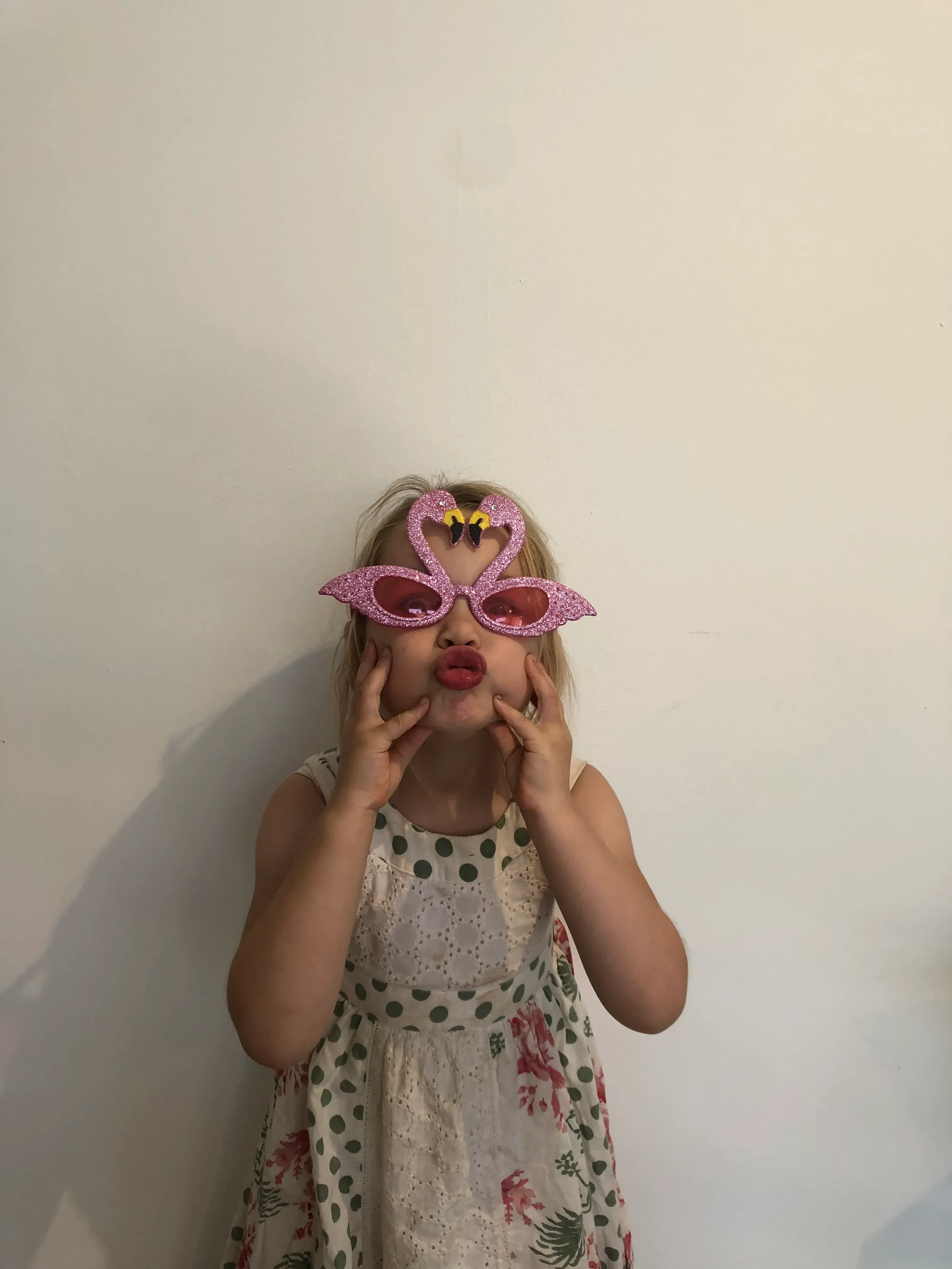 Iris, the 5-year-old inspiration and 'I' in the JAIM name, showing off a colorful pixel art design. Representing the joy of creative play for young children.