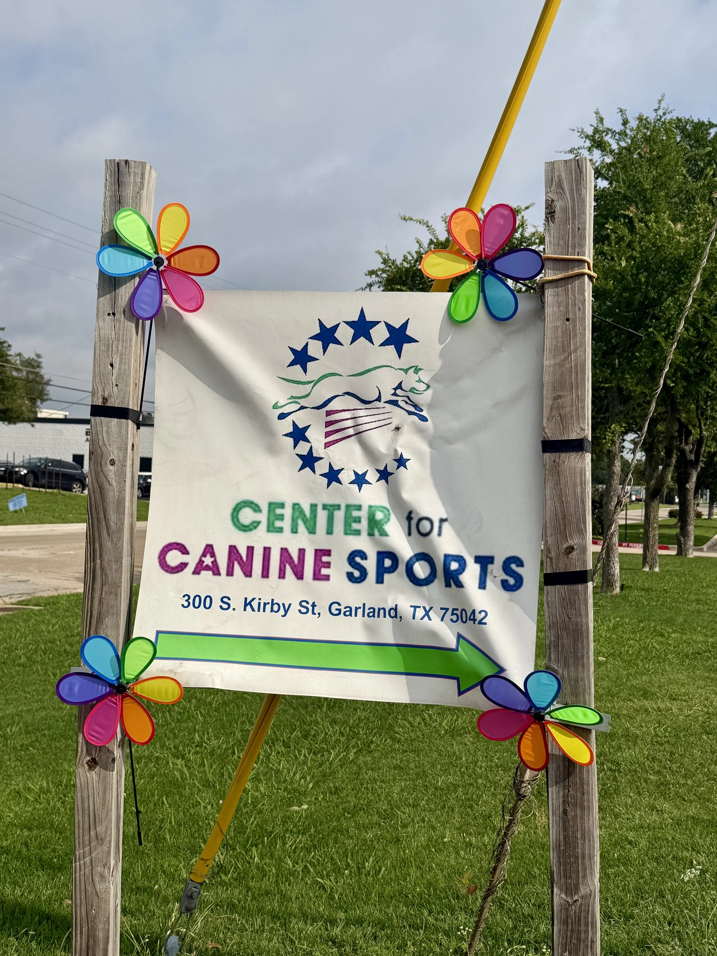 center for canine sports sign bedecked with flowers for ccs spring trial 2026
