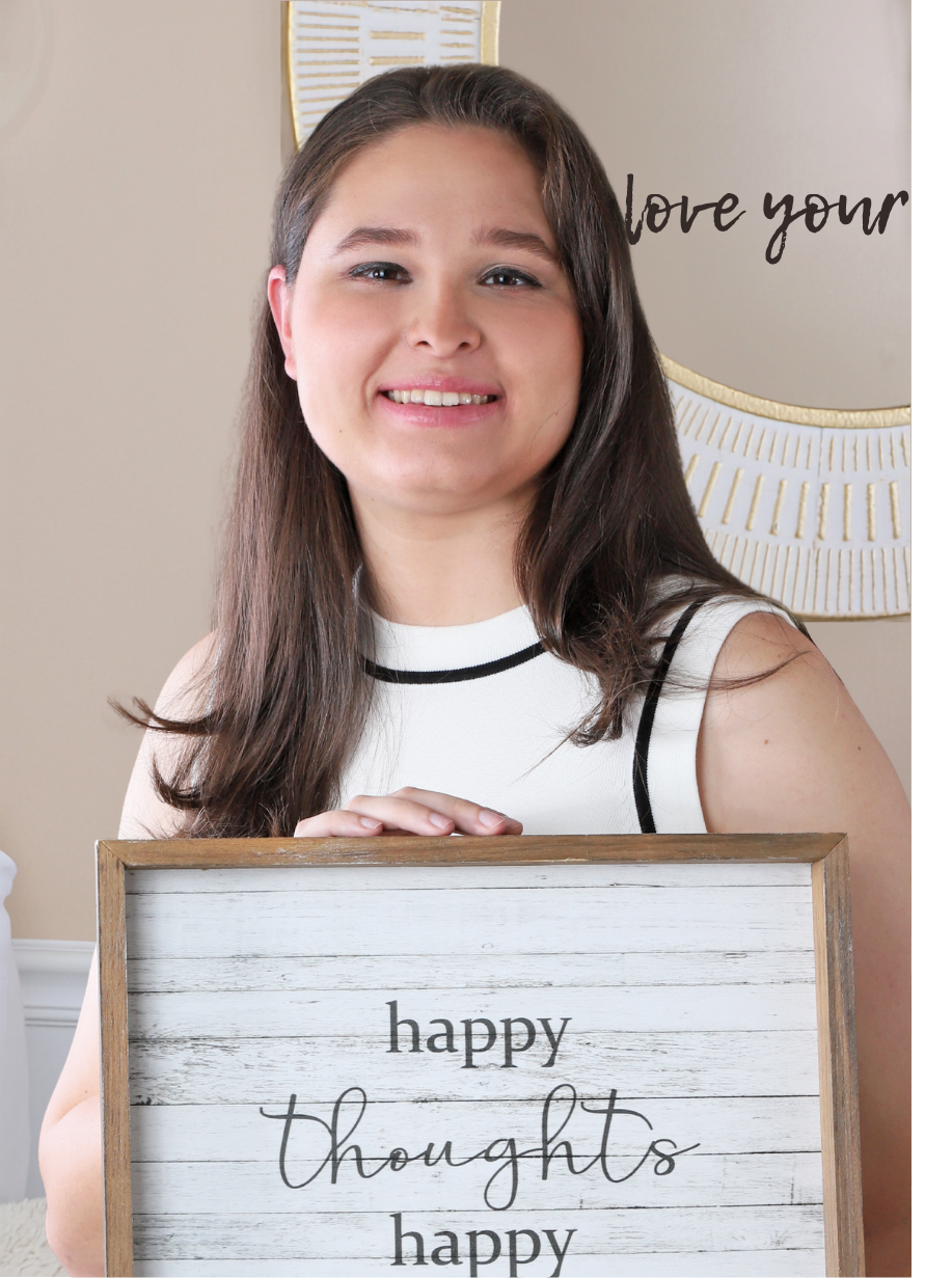Katelyn Macias, child and adolescent therapist in Stuart, Florida, holding a positive affirmation sign, representing supportive therapy for anxiety, depression, emotional regulation, self-esteem, and coping skills
