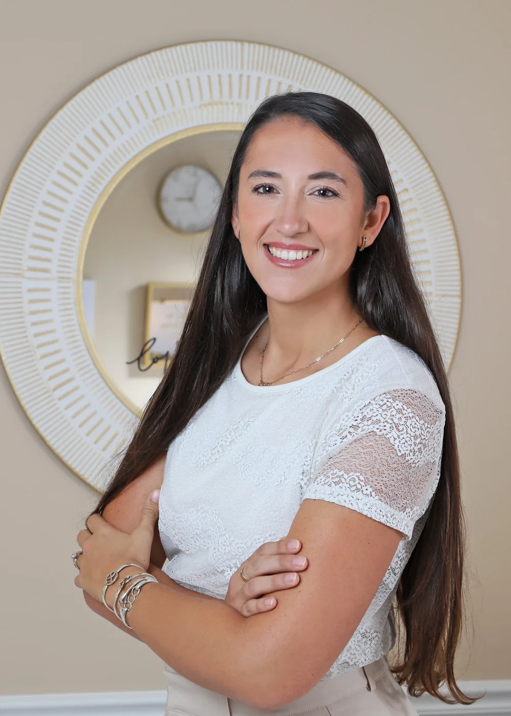 Emily Espinoza, MA, NLC-P, Registered Marriage and Family Therapist Intern in Stuart, Florida, smiling in a welcoming therapy office
