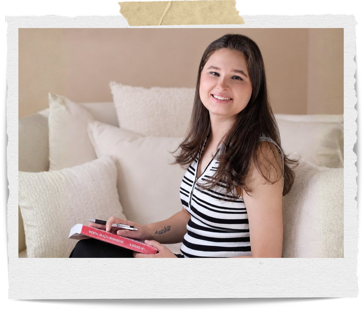 Katelyn Macias, Registered Mental Health Counselor Intern, holding a mental health workbook in a calm counseling space, reflecting child and adolescent therapy, coping skills, emotional regulation, and young adult counseling in Stuart, Florida
