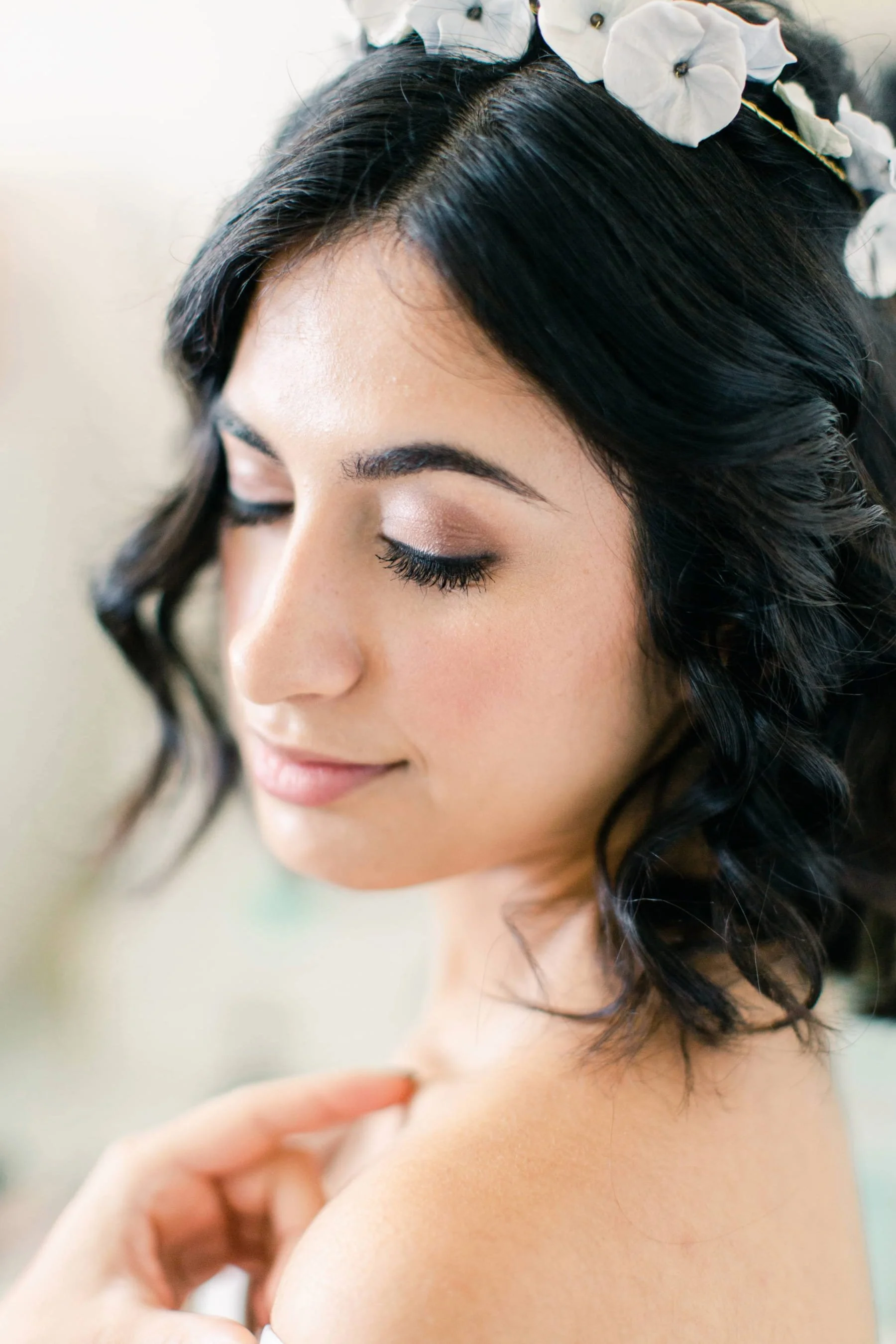 A close up portrait of a bride wearing a modern, natural makeup look.