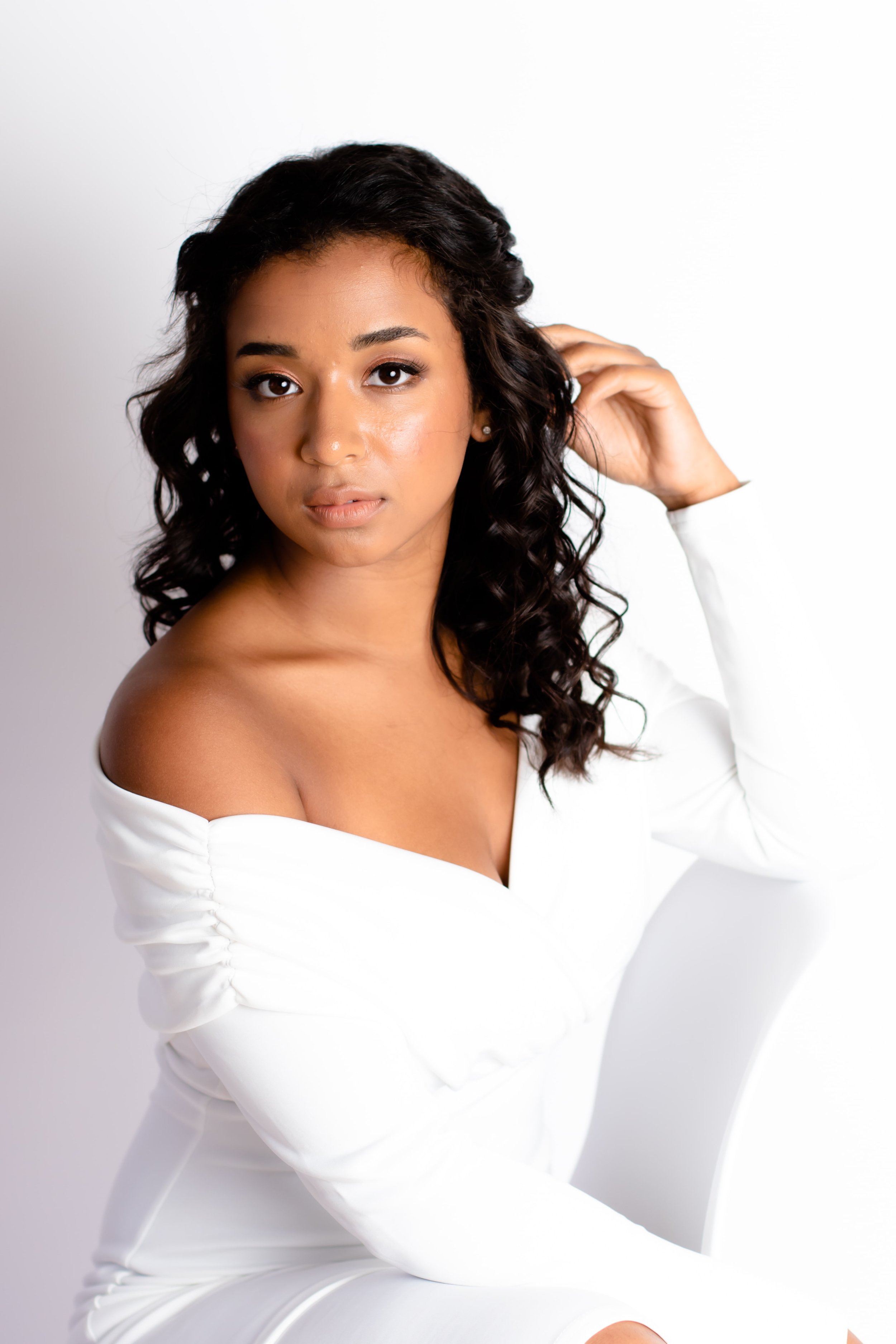 A portrait of her bride wearing her hair in her natural curls for her wedding day.