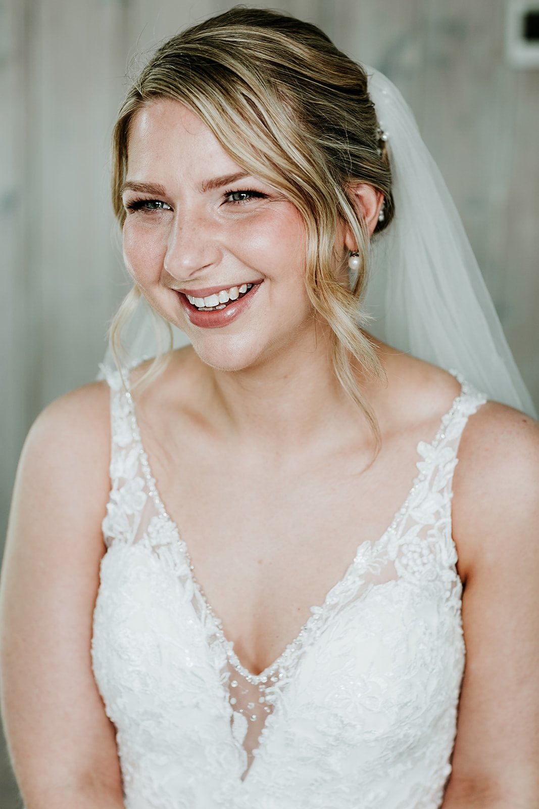 A portrait of a bride wearing a natural, radiant makeup look for her London wedding.