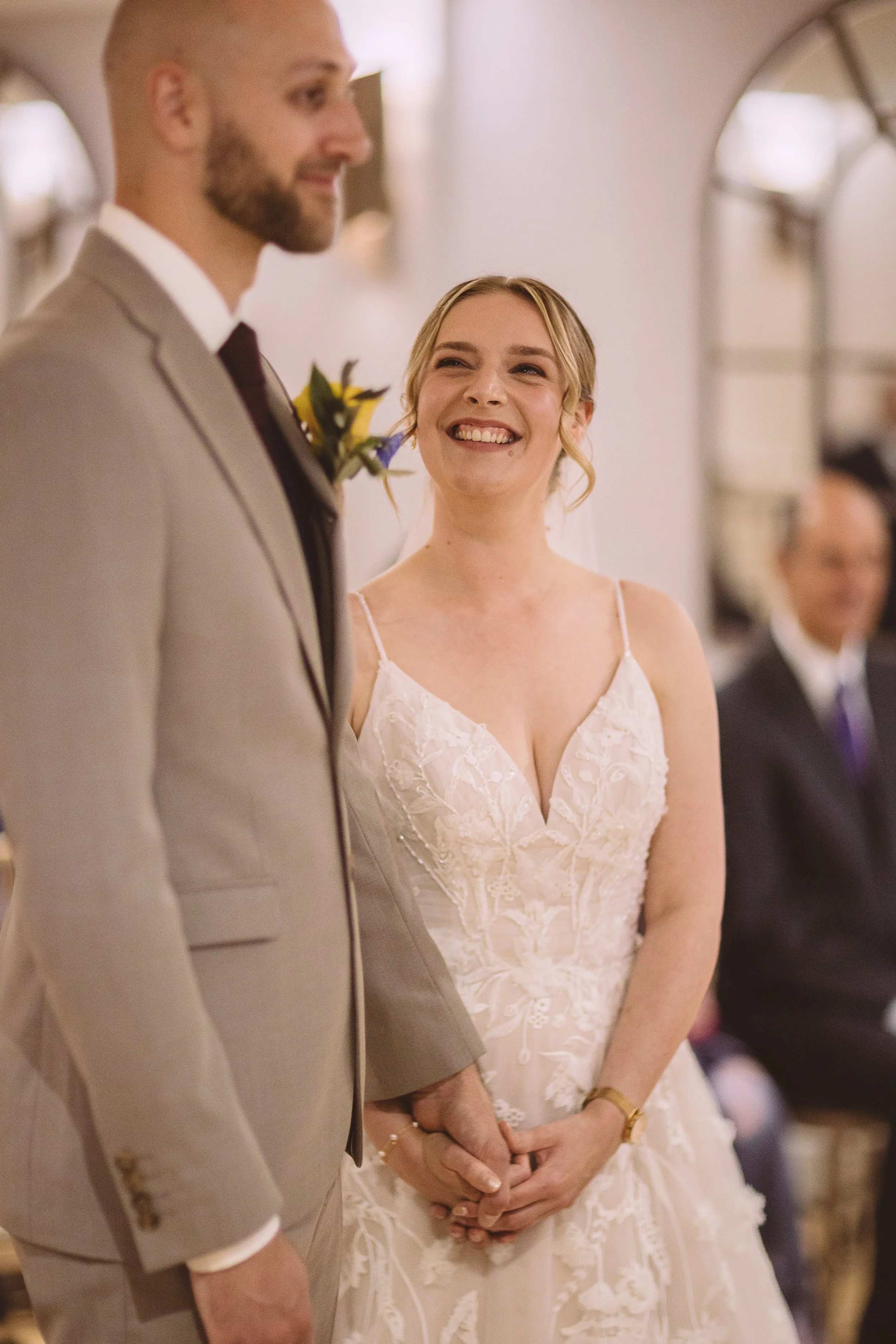 A bride during her wedding ceremony wearing a modern, natural makeup look for her wedding at Woodhall Manor in Suffolk.