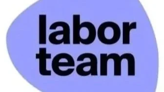 Blue guitar pick-shaped sign with black text that reads 'labor team'.