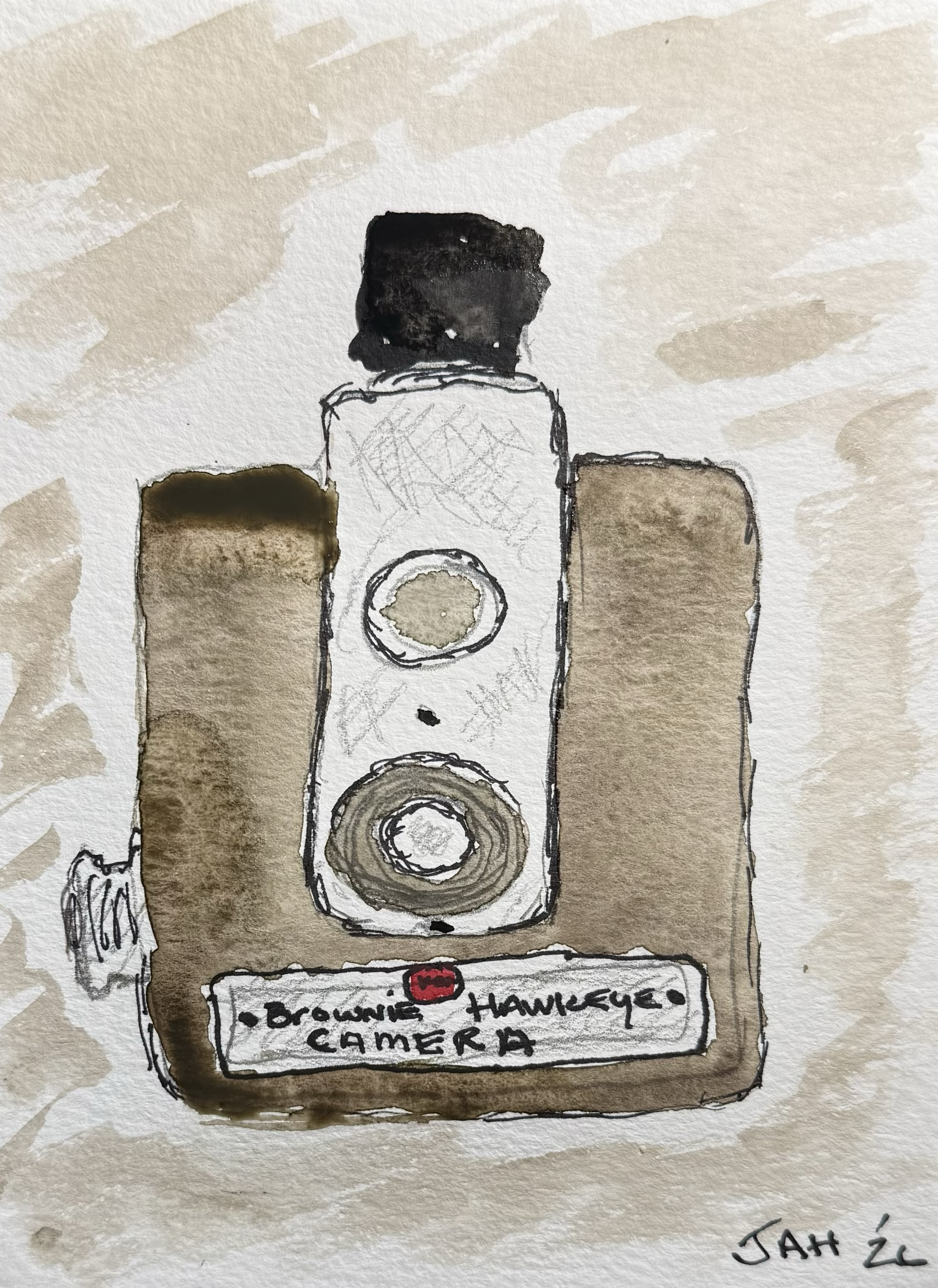 A watercolor painting of a speaker on a table with a label that reads 'Hawkeye Camper'. The background has beige and brown tones, with the artist's signature 'JAH '26' in the bottom right corner.