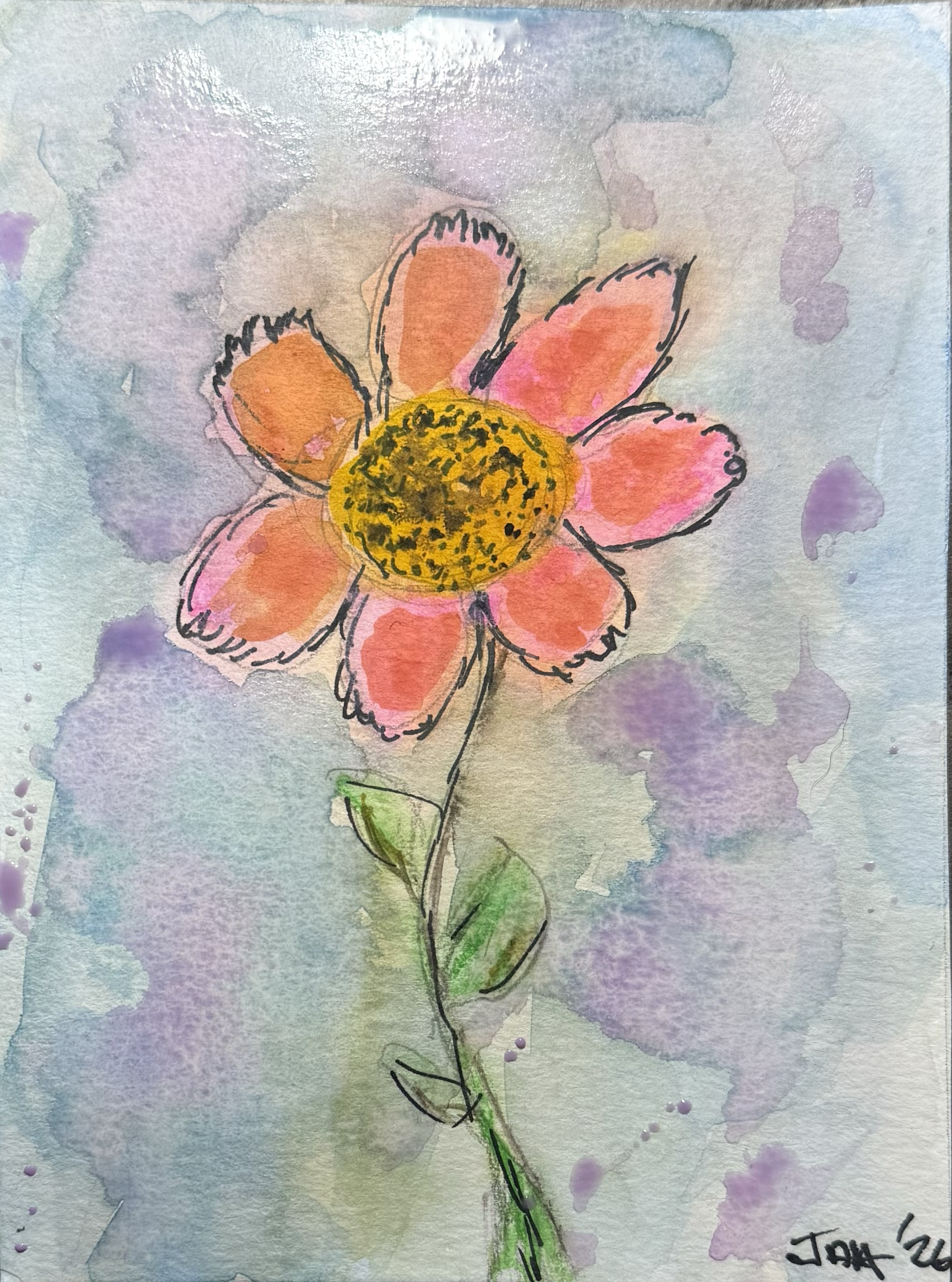 A watercolor painting of a flower with six orange and pink petals, a yellow center with black dots, and green leaves and stem. The background has purple and blue watercolor washes.