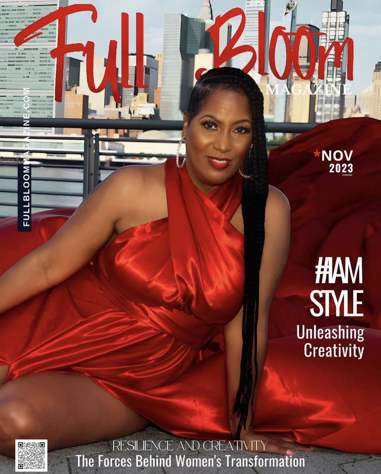 A woman wearing a red satin flying dress sitting, with a city skyline behind her. The magazine cover features the title 'Full Bloom Magazine' and includes headlines about fashion, creativity, and women's transformation.