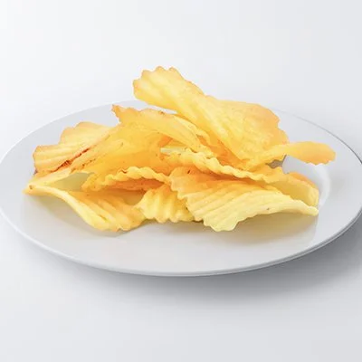 A photo of a small white plate topped with a small pile of golden ruffle-cut potato chips