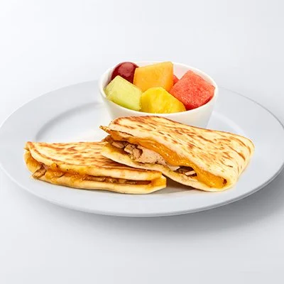 A photo of the Turkey Melt, with Seasoned Grilled Turkey and cheddar cheese in a griddled pita