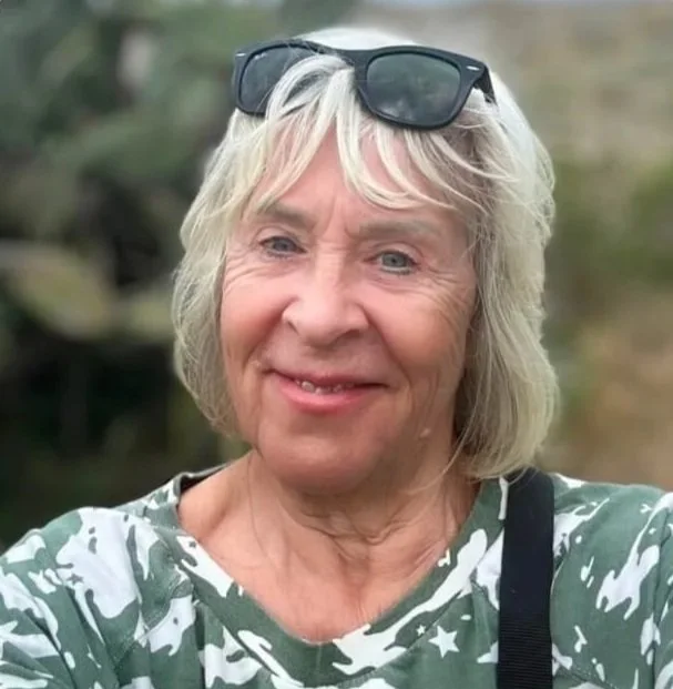 portrait of claire with sunglasses on her head
