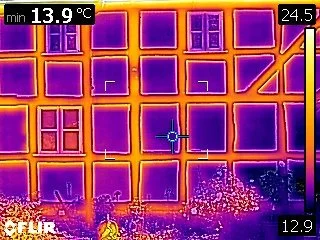 Hygrothermal investigations of an historic timber framed building - the image shows differential thermal heat patterns between the infill material and the historic timber frame, with the darker edges to the perimeter indicative of trapped moisture.
