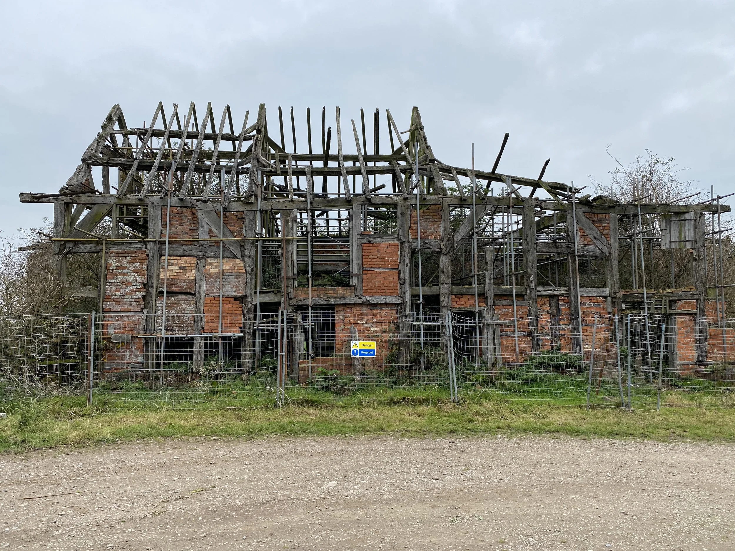 Failed timber frame in a ruinous condition prior to the analysis of individual framing members to further understand their condition.