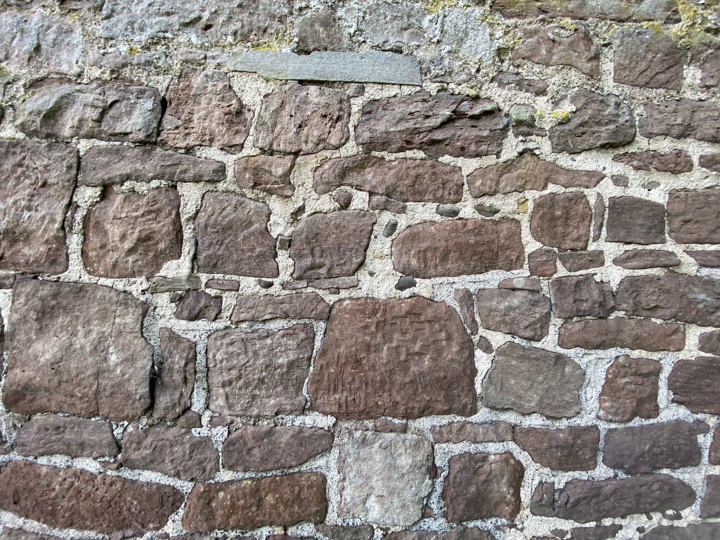 Lime mortar analysis and material specification for the repair of a traditionally constructed stone wall in Shropshire.