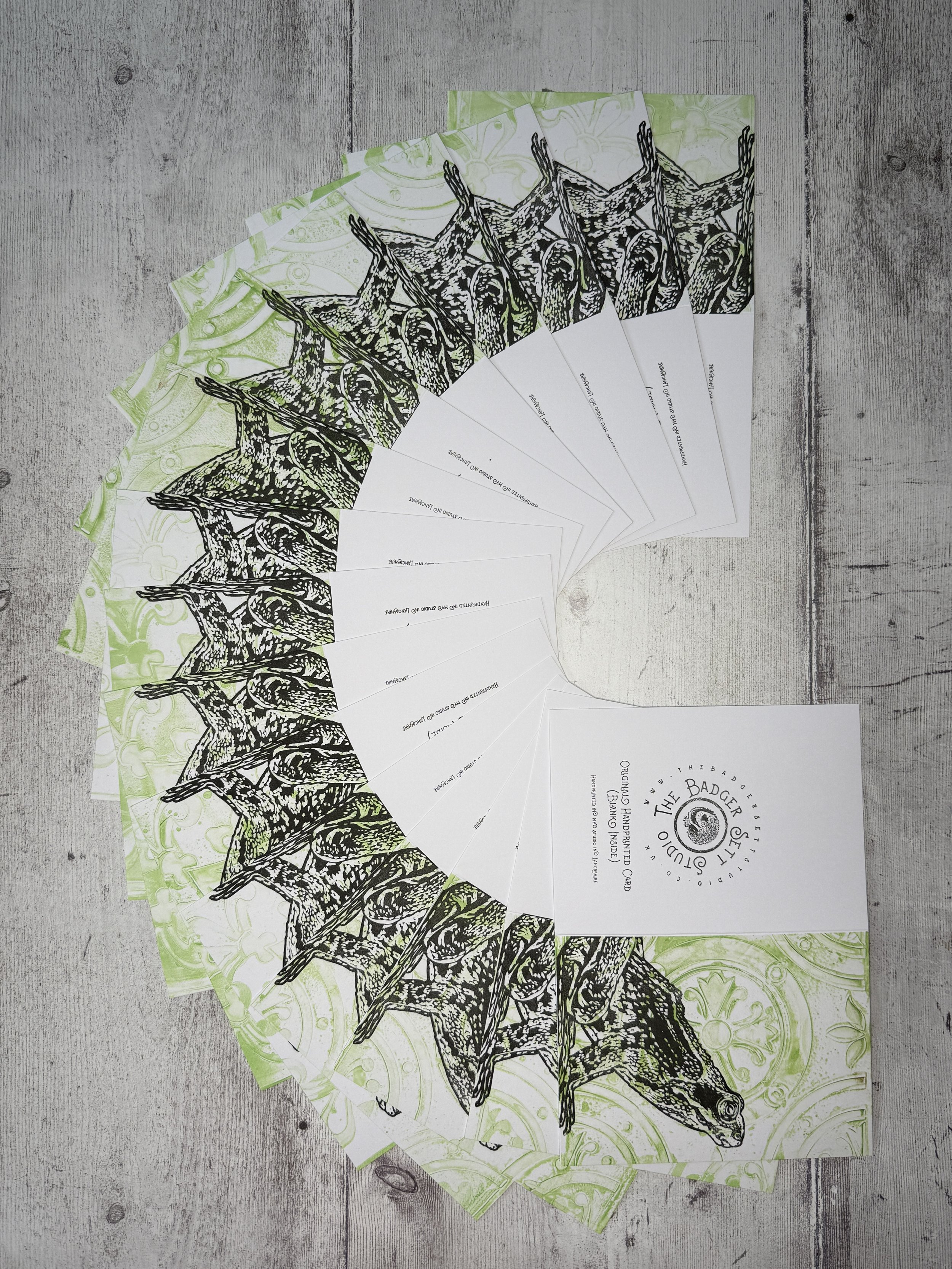 The Badger Sett Studio Handprinted Lino Print Frog Cards arranged in a fan shape.jpg
