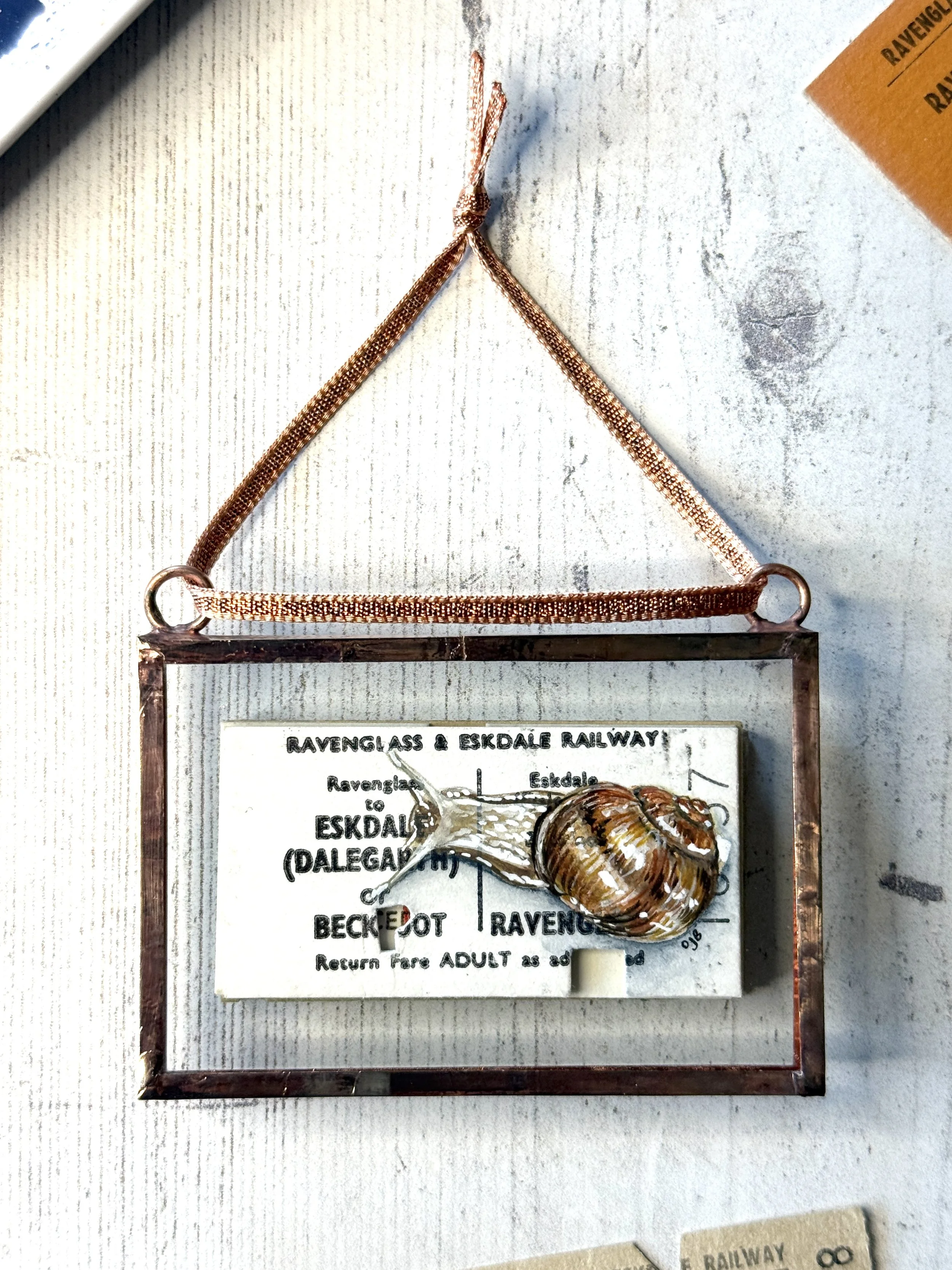 Snail - Ravenglass & Eskdale Railway (R&ER) Original Ticket | Copper Foil Framed Original Painting