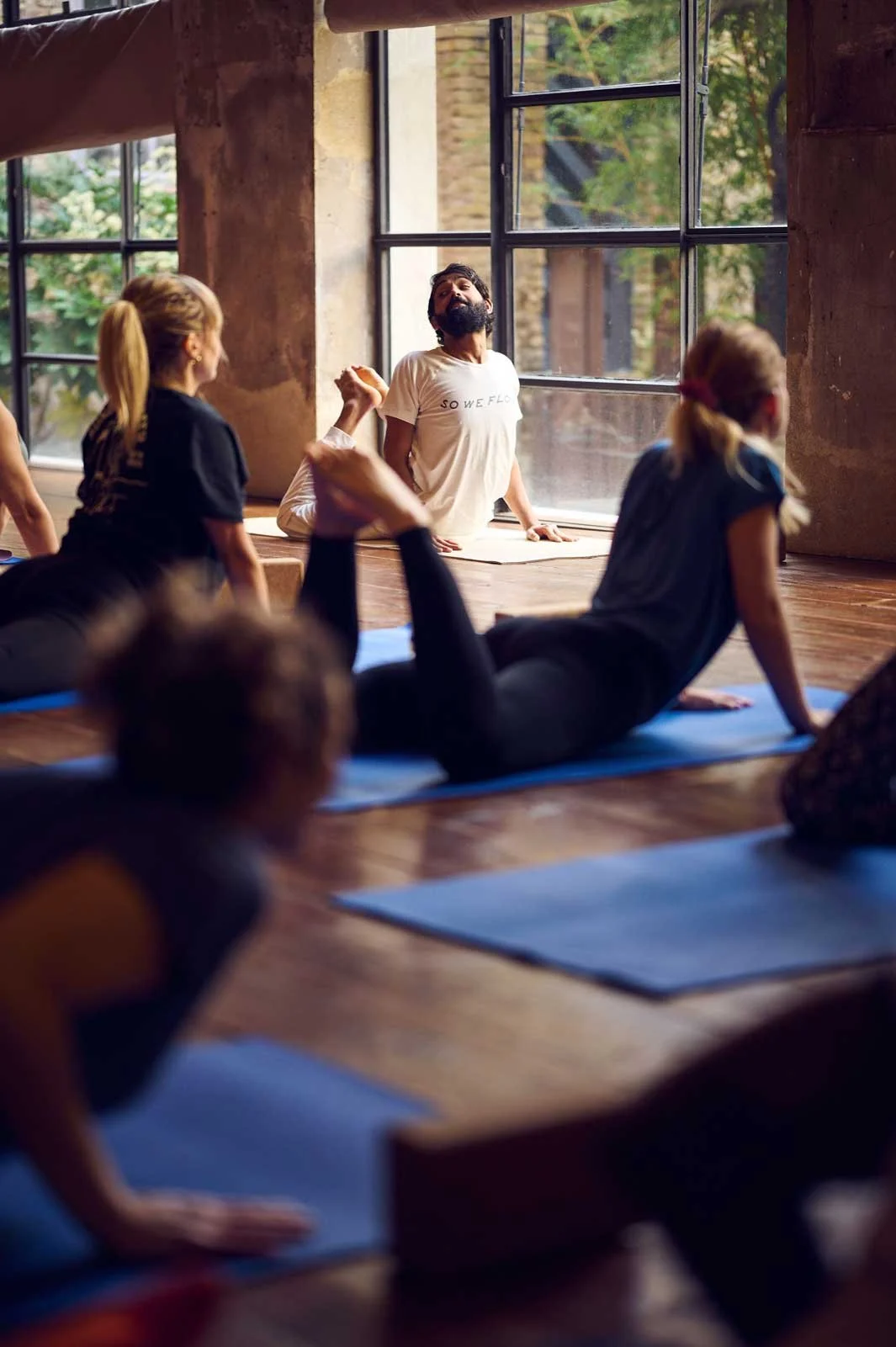 yoga-class-instructor-students-indoor.jpg
