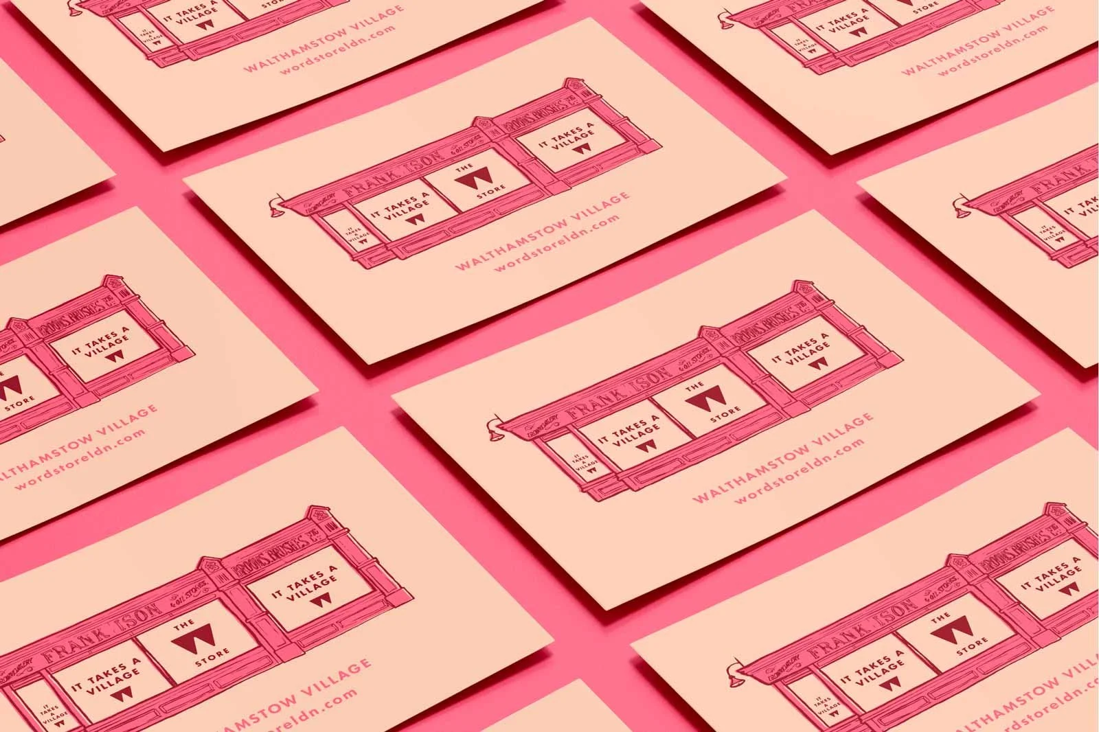 Multiple promotional postcards featuring a storefront illustration with the logo and slogan 'It takes a village,' arranged on a pink background.