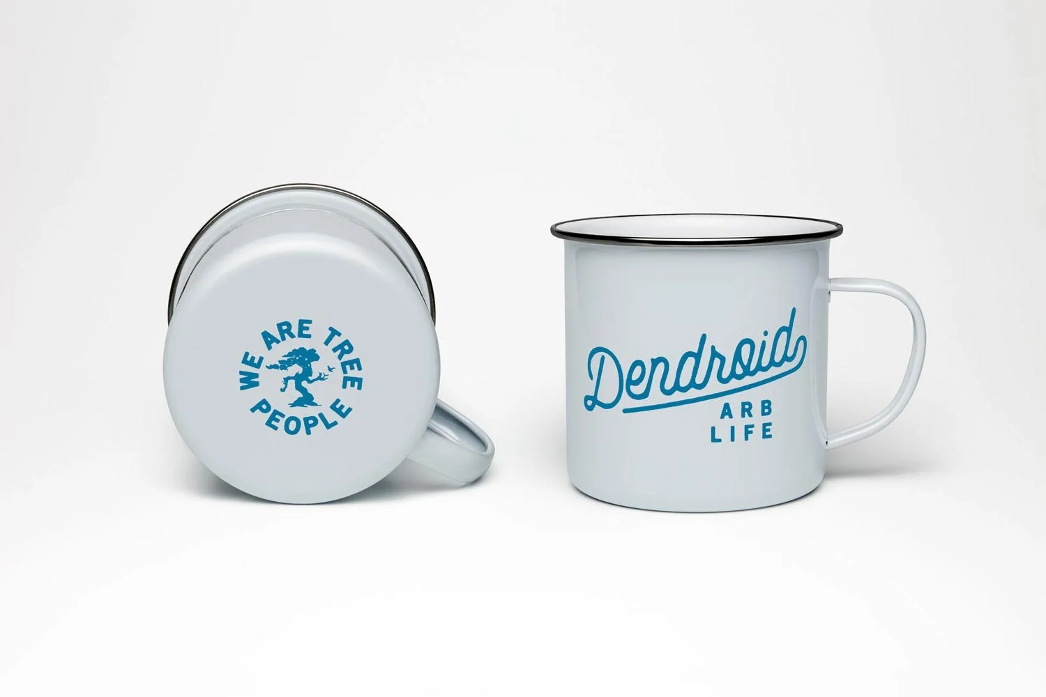 Two white enamel mugs with blue text and graphics on a white background.