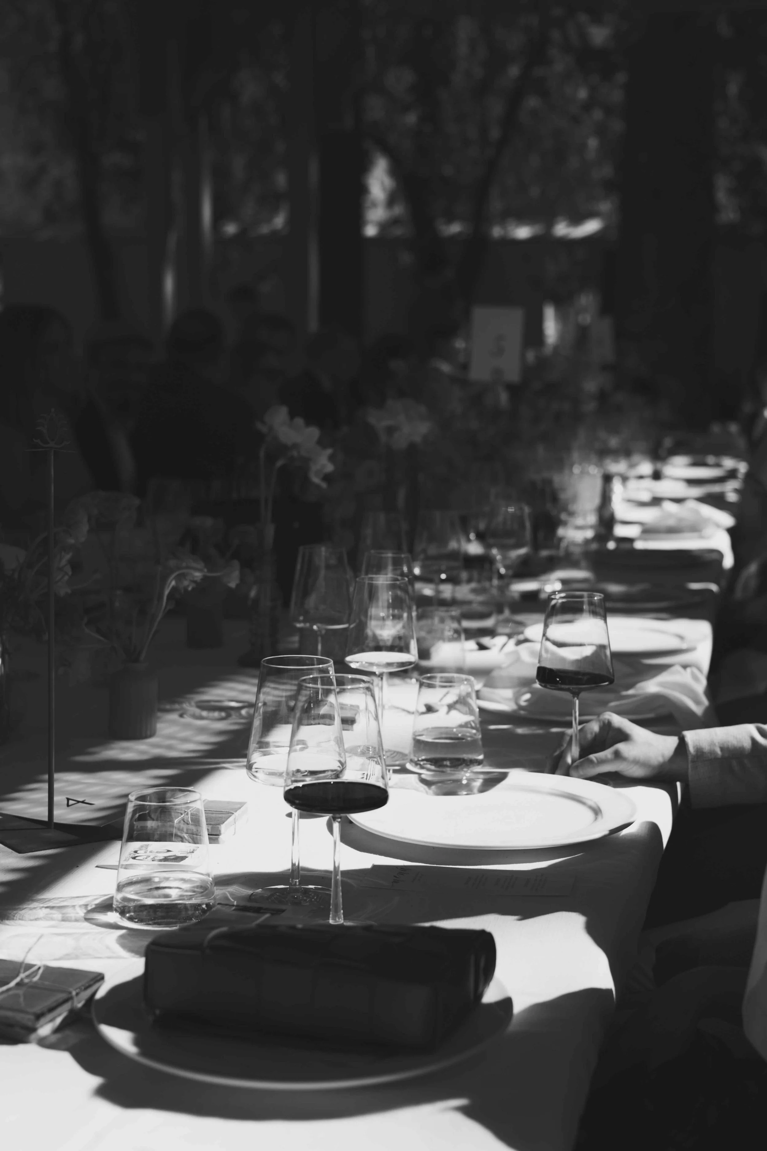 A long table with flowers and wine glasses at a formal Malaga wedding reception