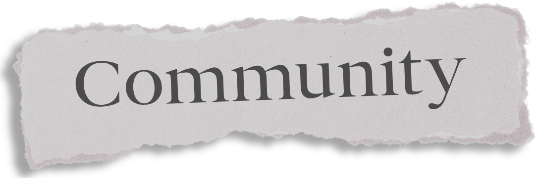 Torn paper with the word 'Community' printed on it.