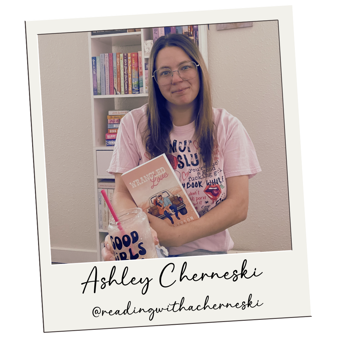 Ashley sitting in front of a book shelf holding the book wild and wrangled in front of her chest with a cold brew coffee in her other hand resting on her knee.
