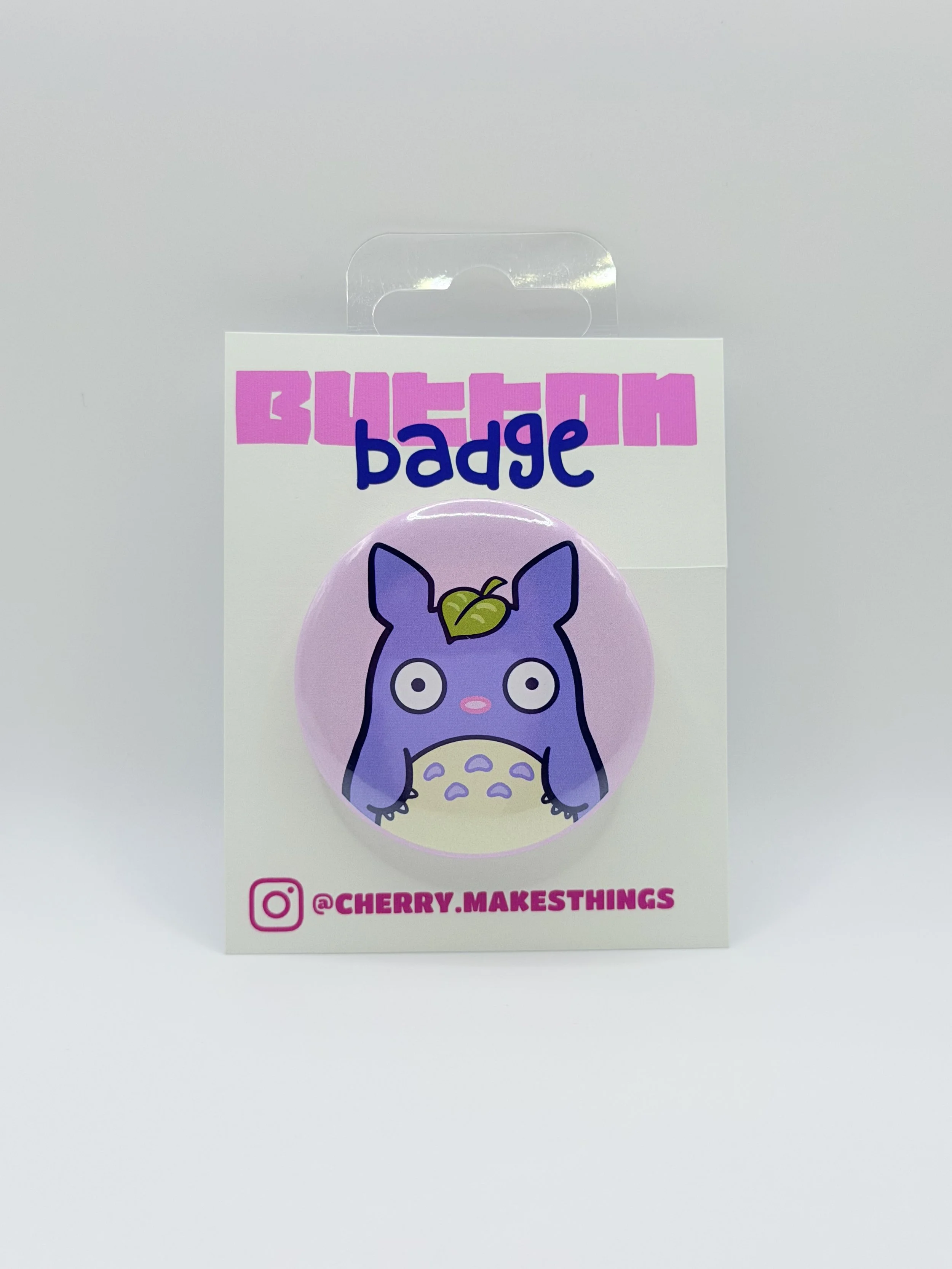 LIL GUY WITH LEAF HAT button badge