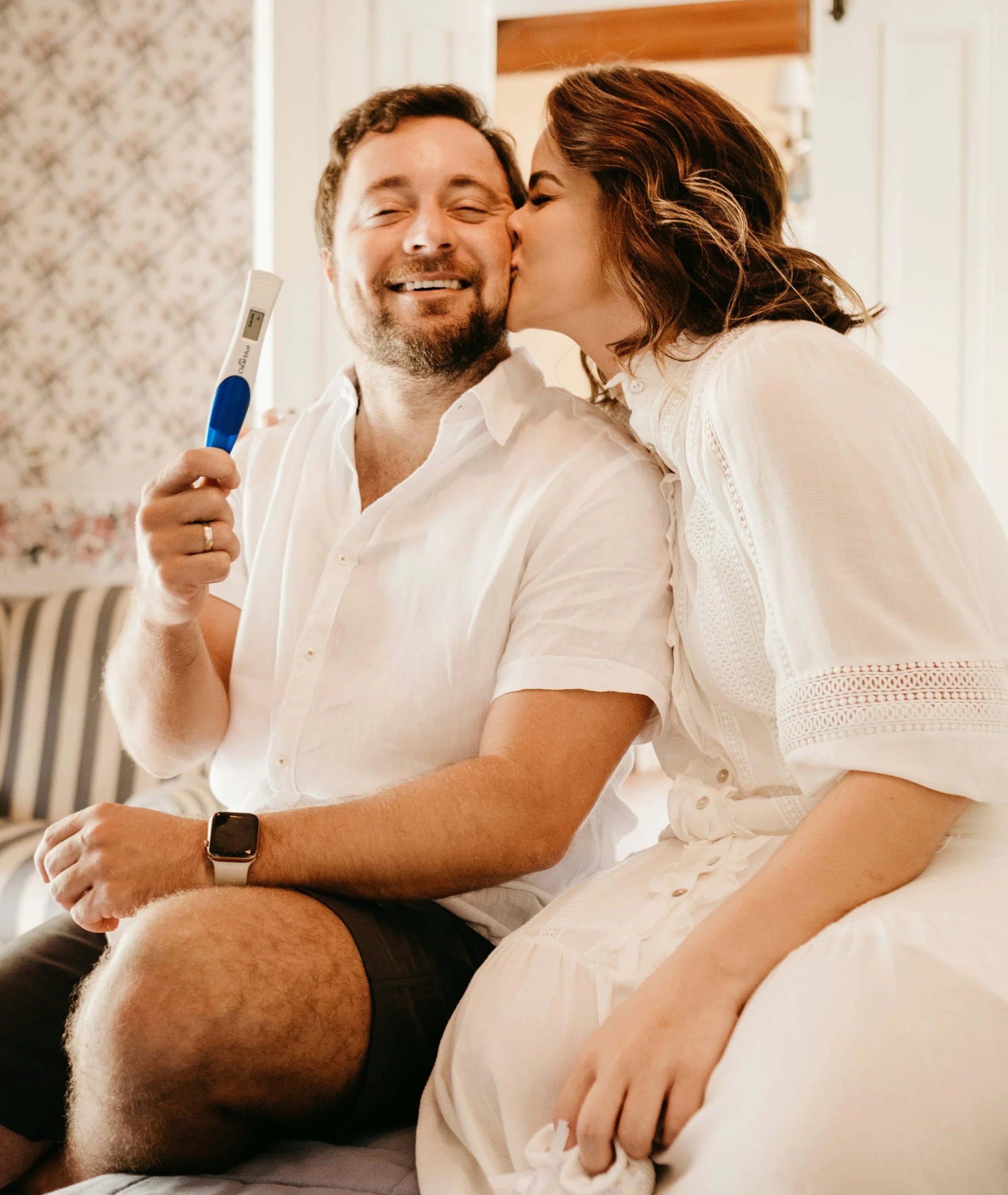  Mom and dad holding pregnancy test 