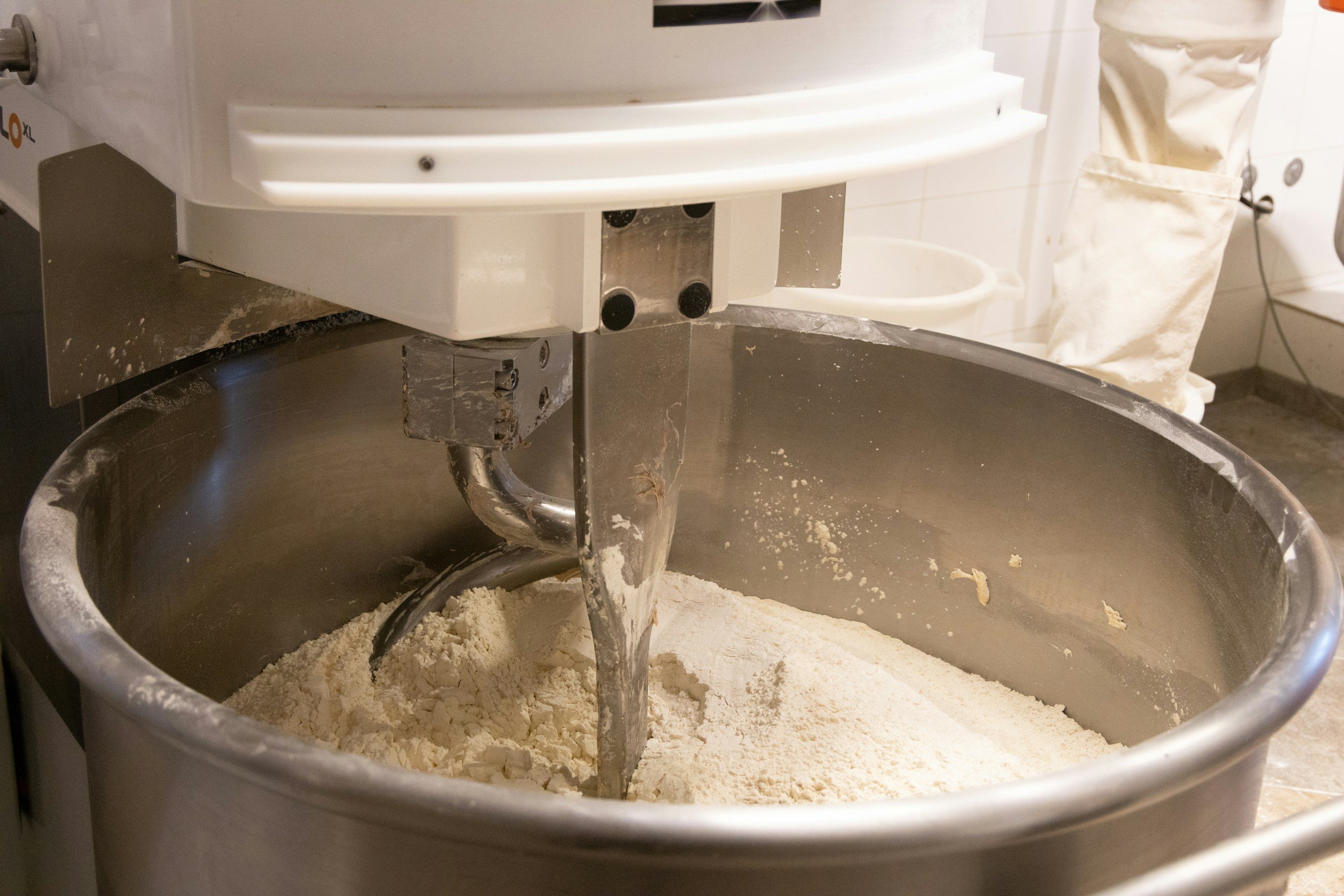 brewers yeast in electric mixer to showcase ingredients for lactation cookies
