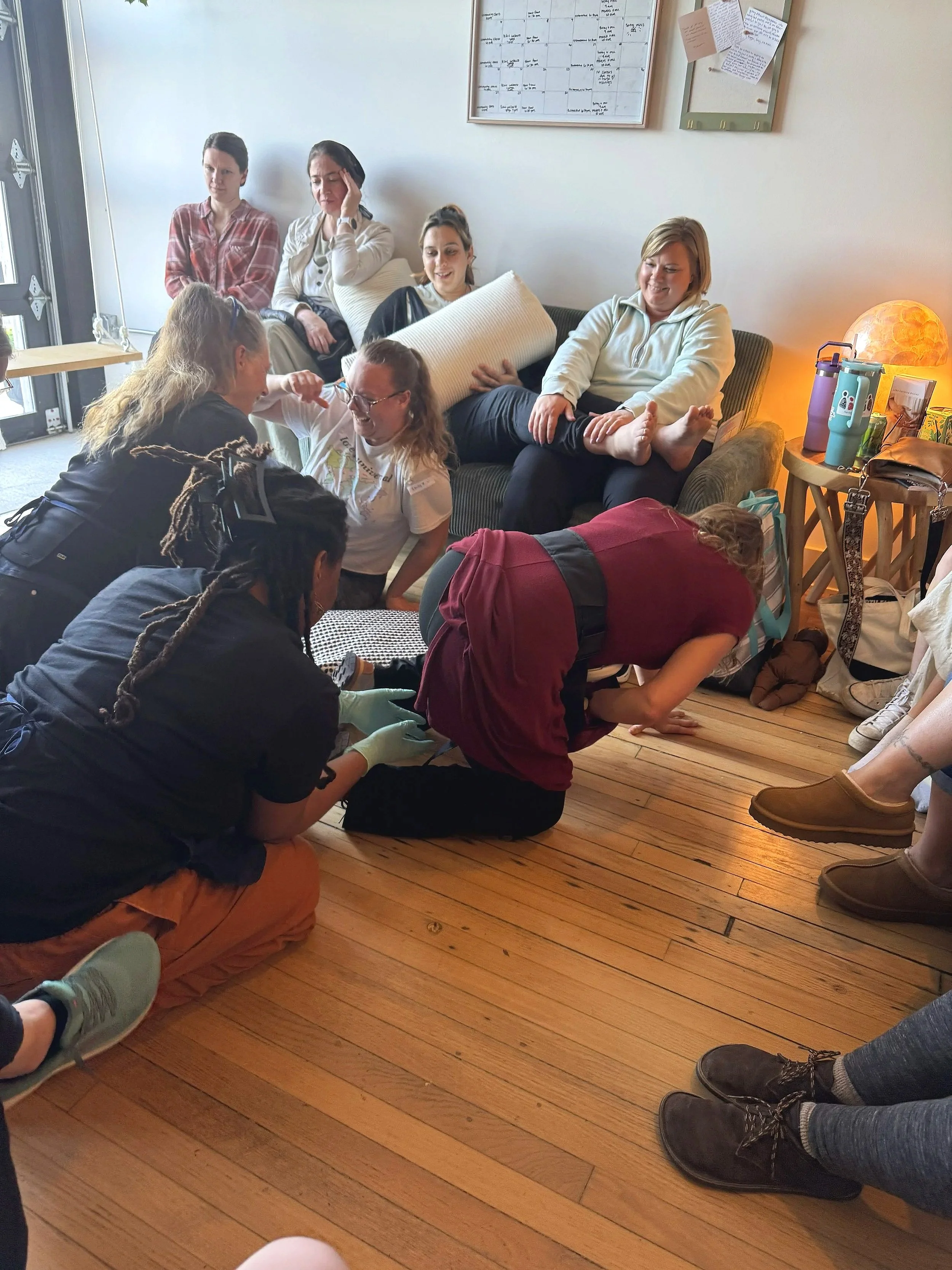 Birth doula in Milwaukee getting hands on training with a Certified Nurse Midwife.