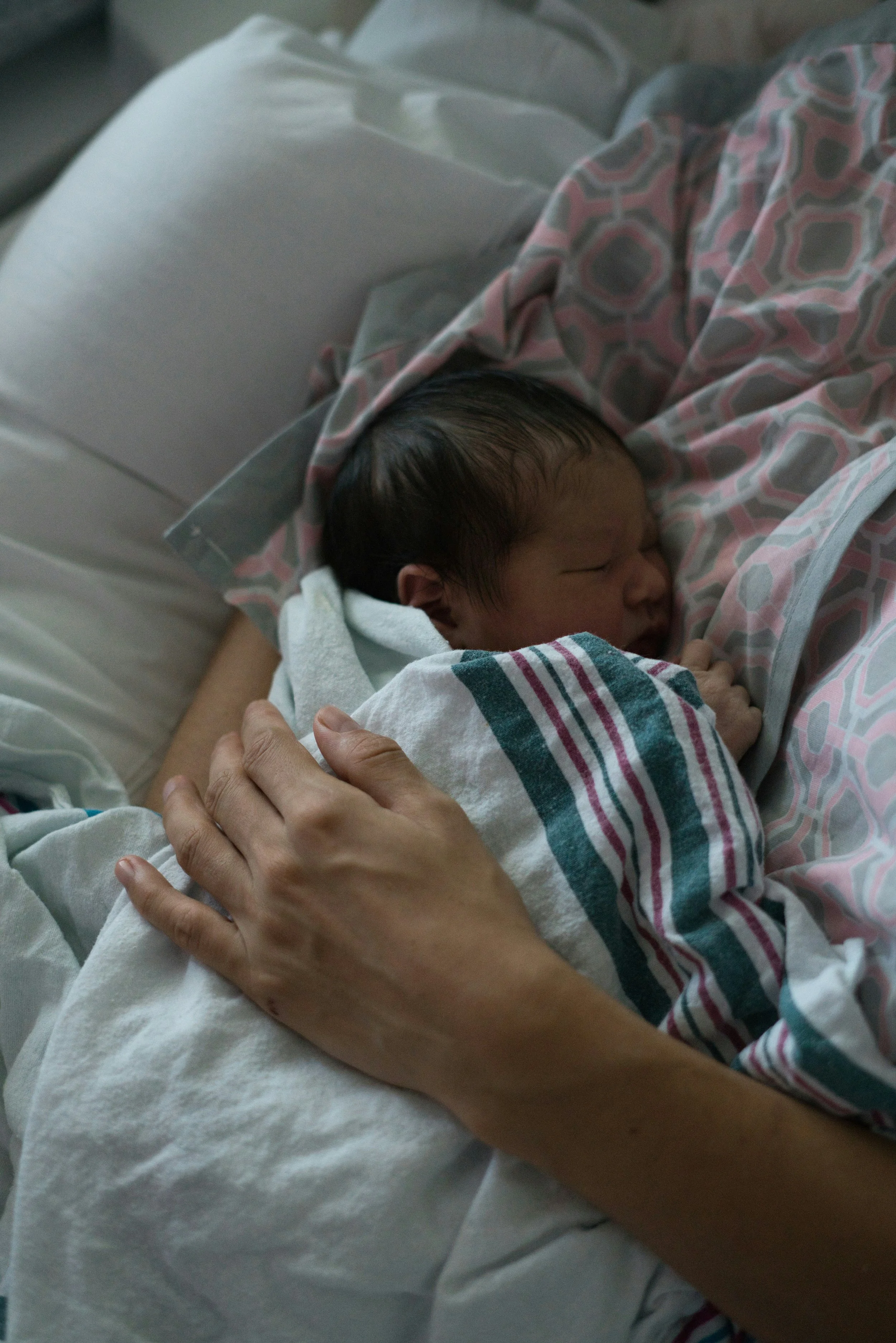 Mom holding newborn after labor induction