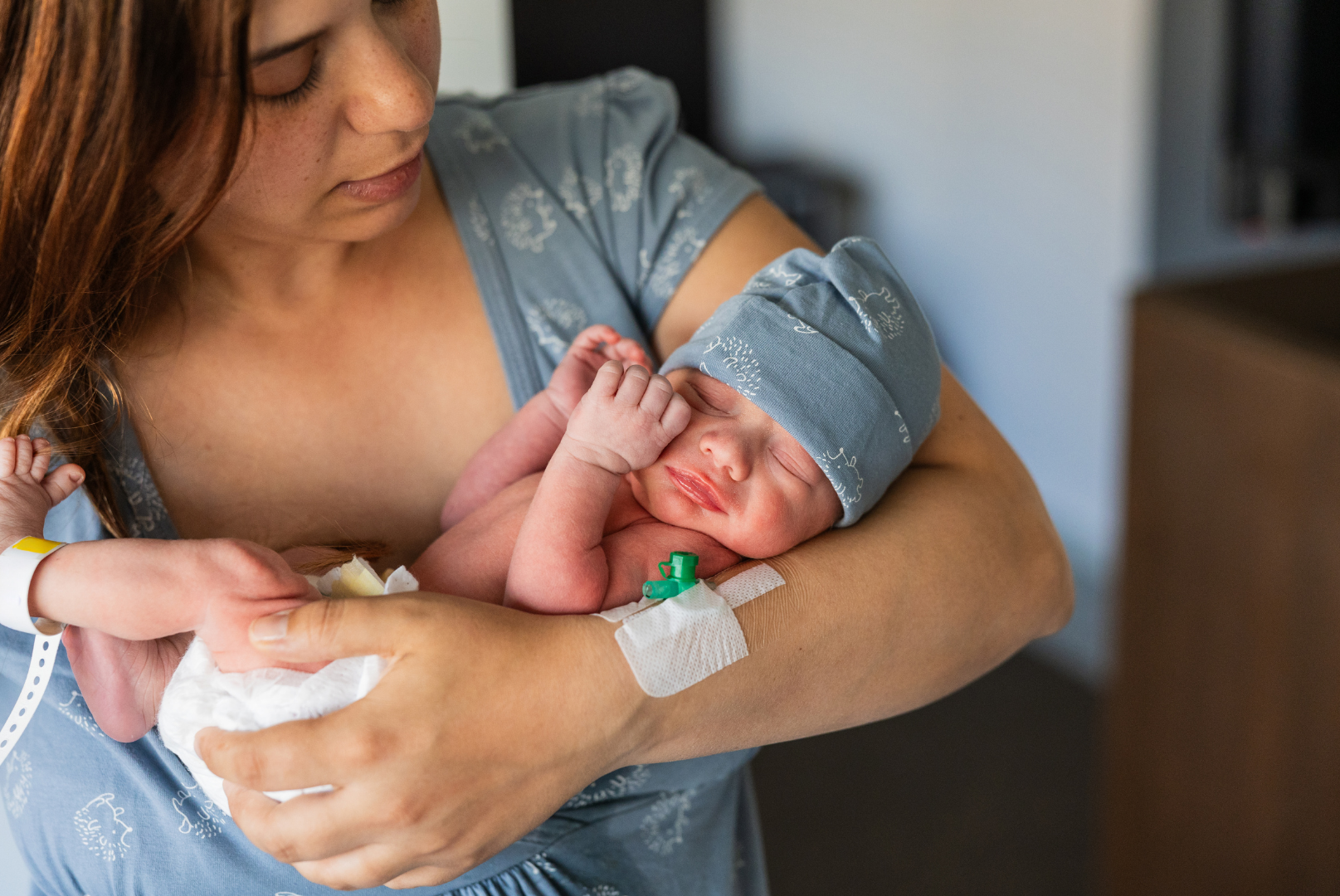 Mom holding baby as she prepares for postpartum