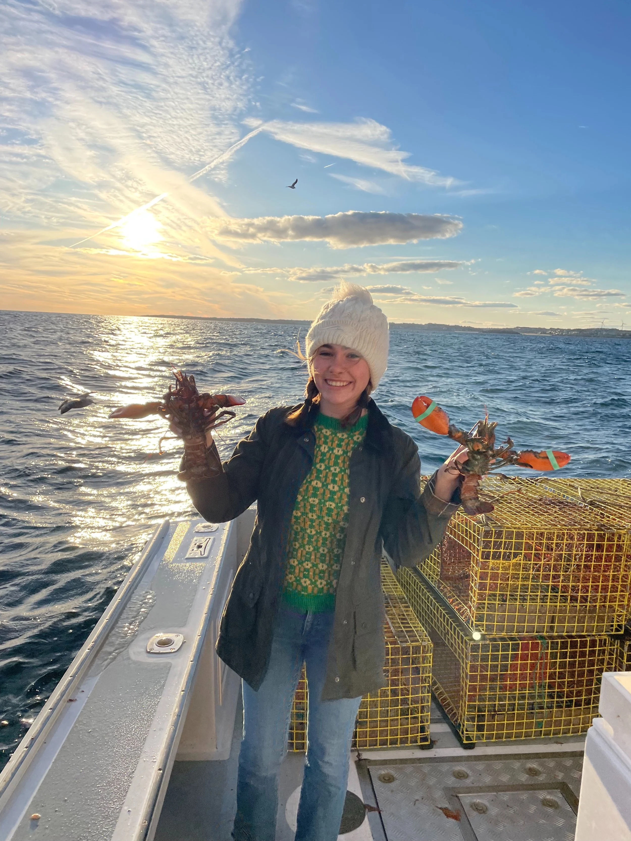 First Mate Grace Holding Lobsters