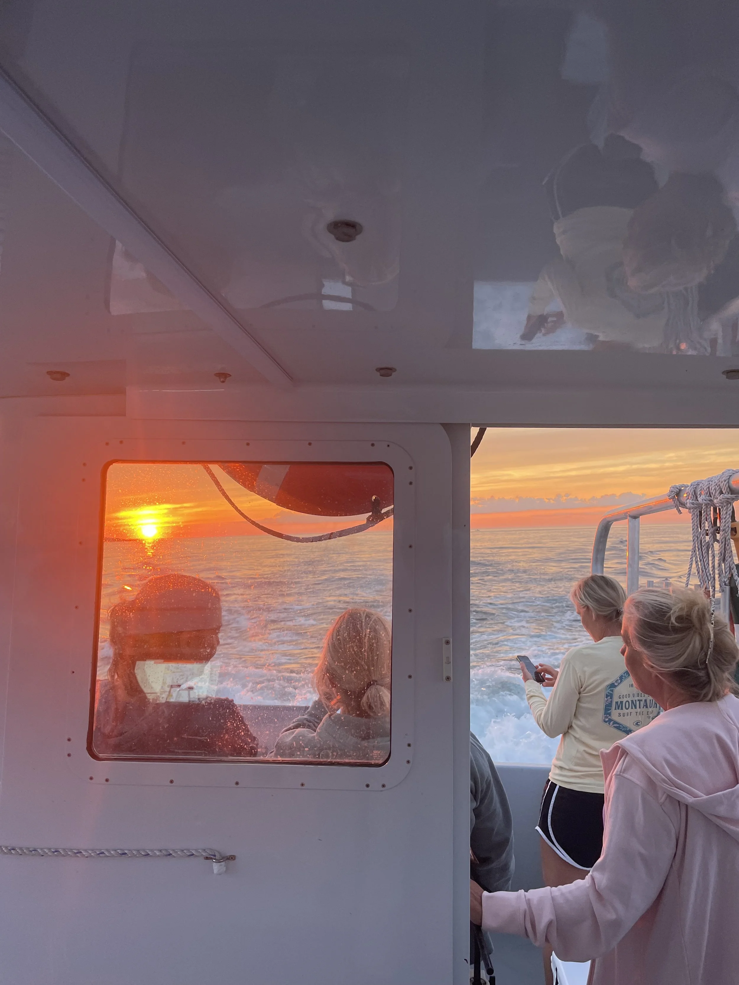 Women enjoying sunset cruise