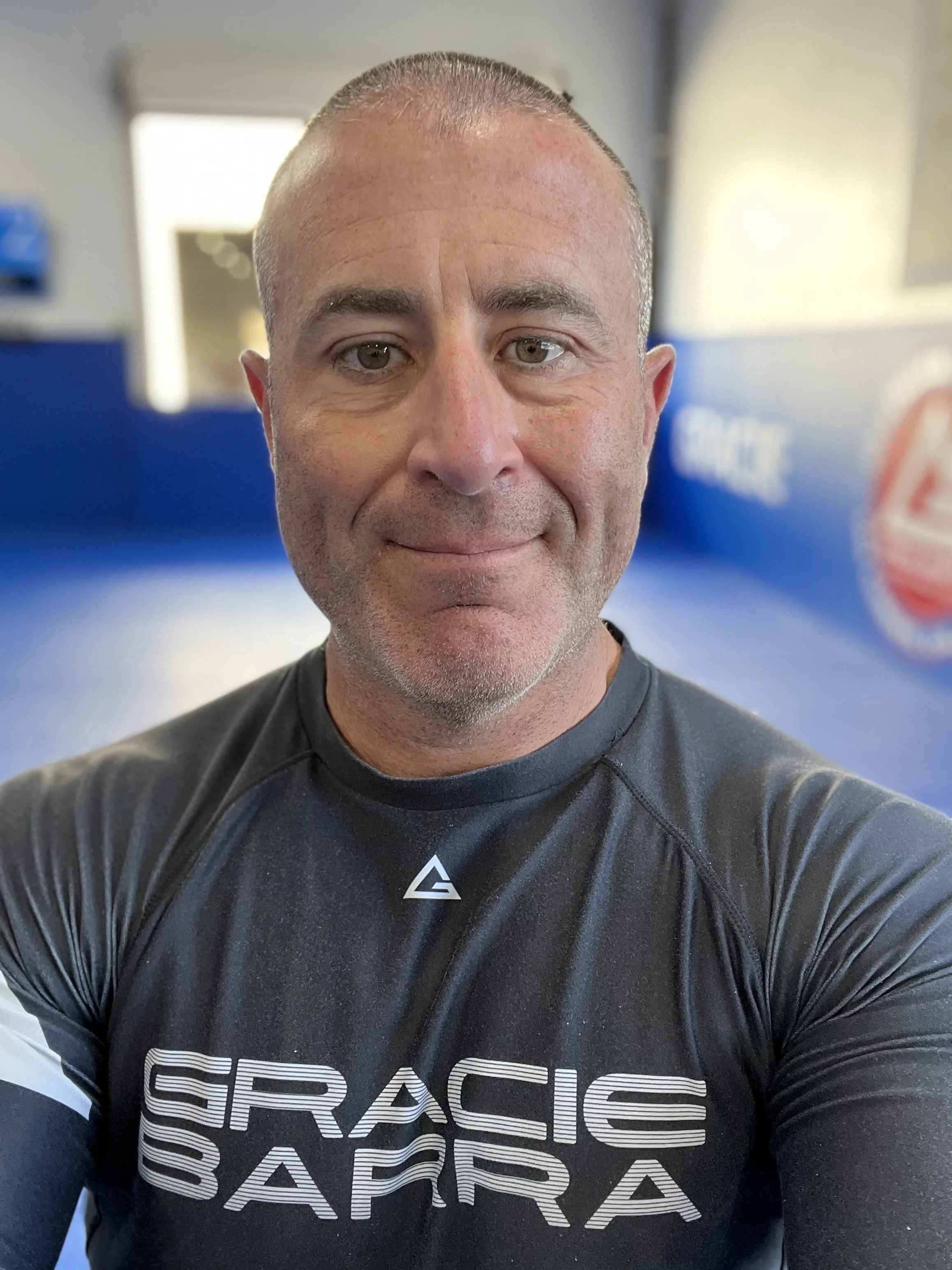Bob Viscount BJJ Black Belt and Registered Dietitian wearing a black rashguard